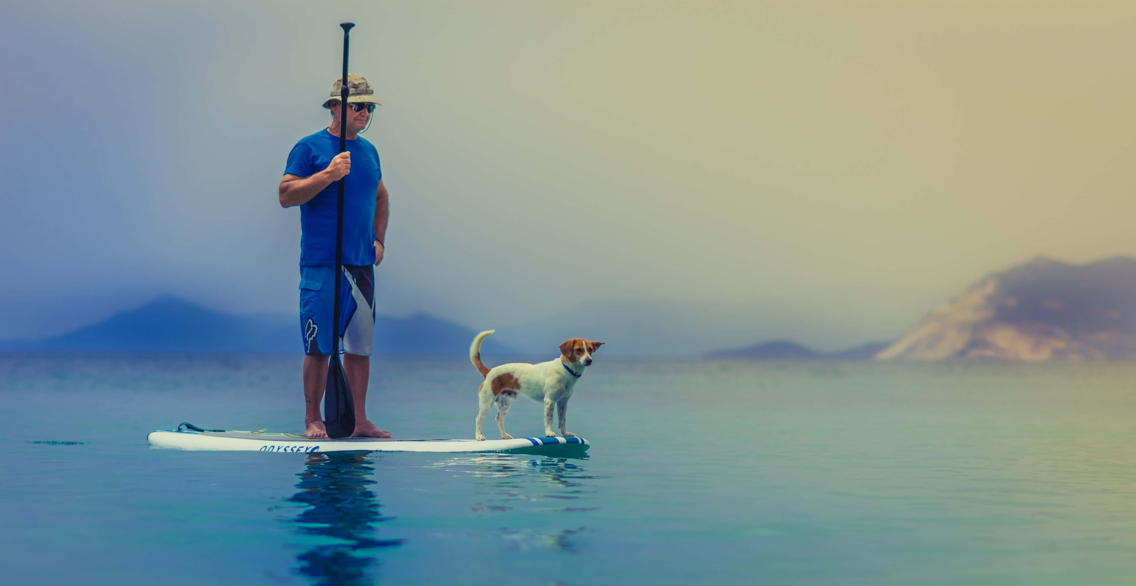 paddleboarding, glassy turquoise water, hazy mountains, 4K Desktop Wallpaper