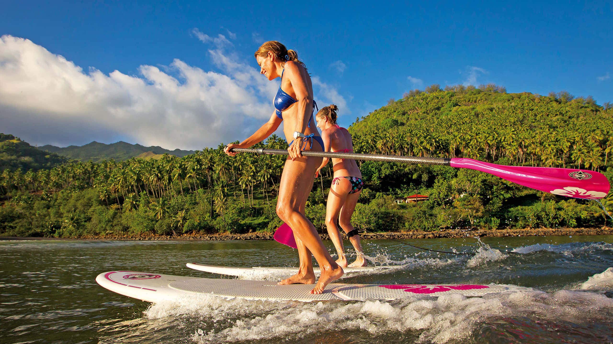 paddleboarding, calm waters, lush green hills, 2K Desktop Wallpaper