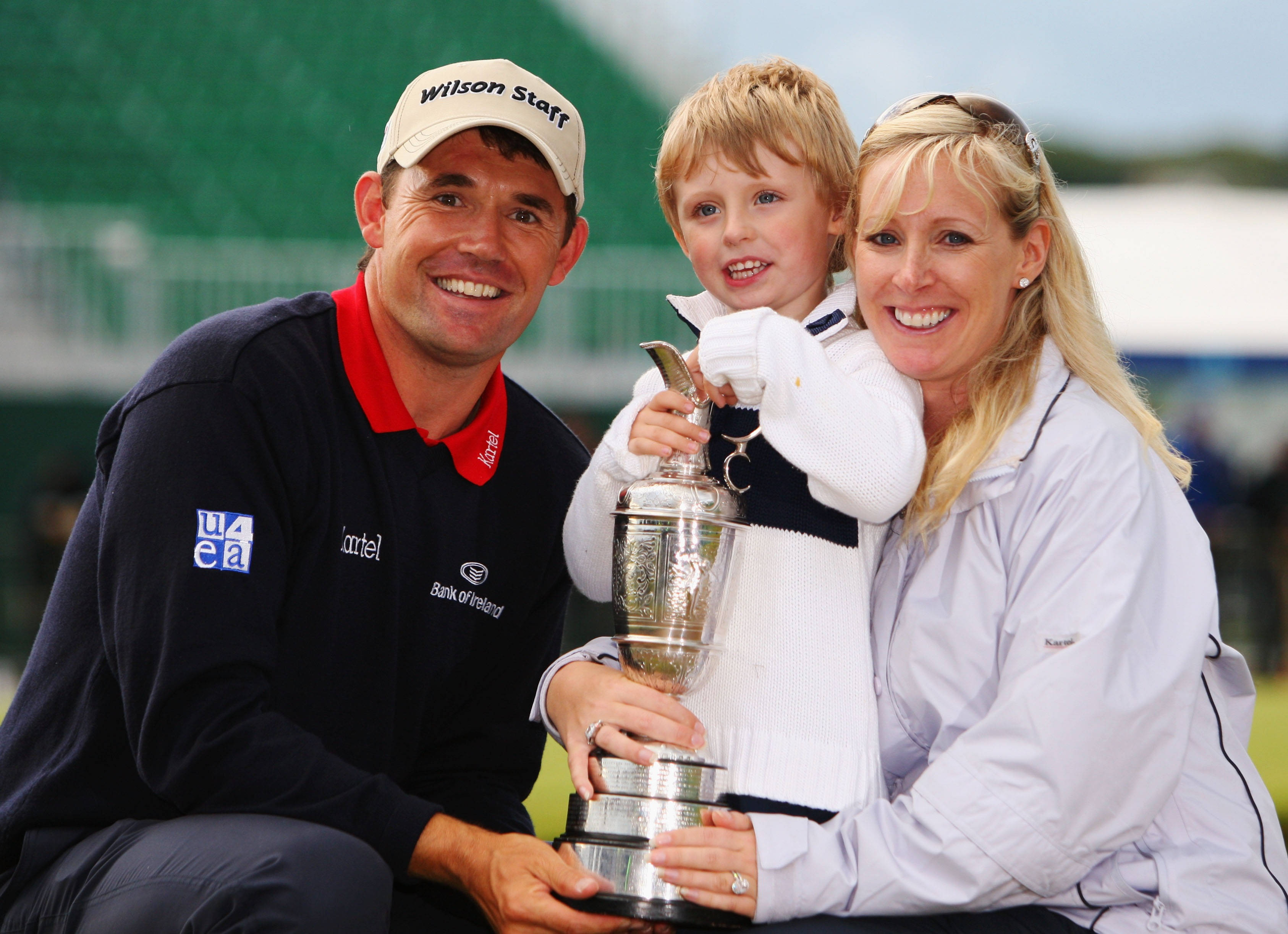 Padraig Harrington, silver trophy, grassy outdoor setting, 2K Desktop Wallpaper