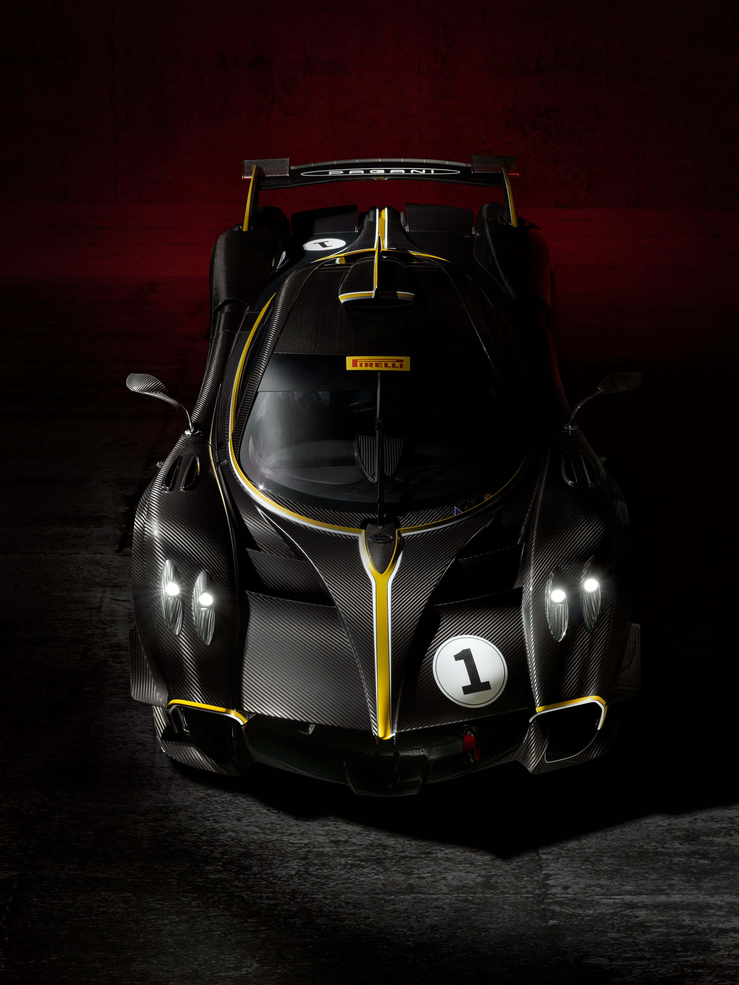 Pagani Huayra, black carbon fiber, gold accents, 2K Phone Wallpaper