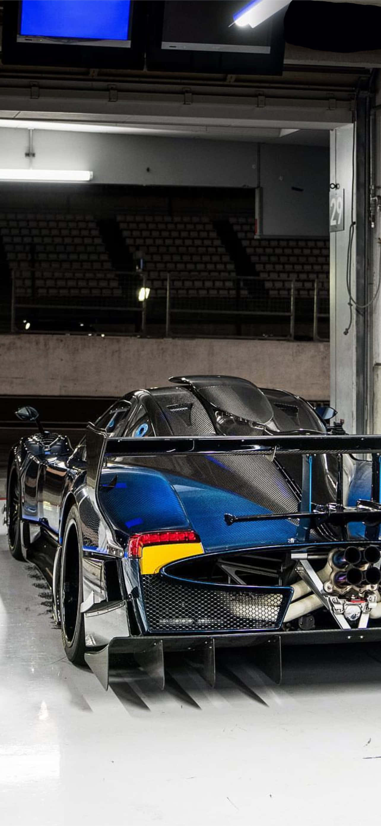 Pagani Huayra, sleek blue hypercar, exposed exhaust, 2K Phone Wallpaper