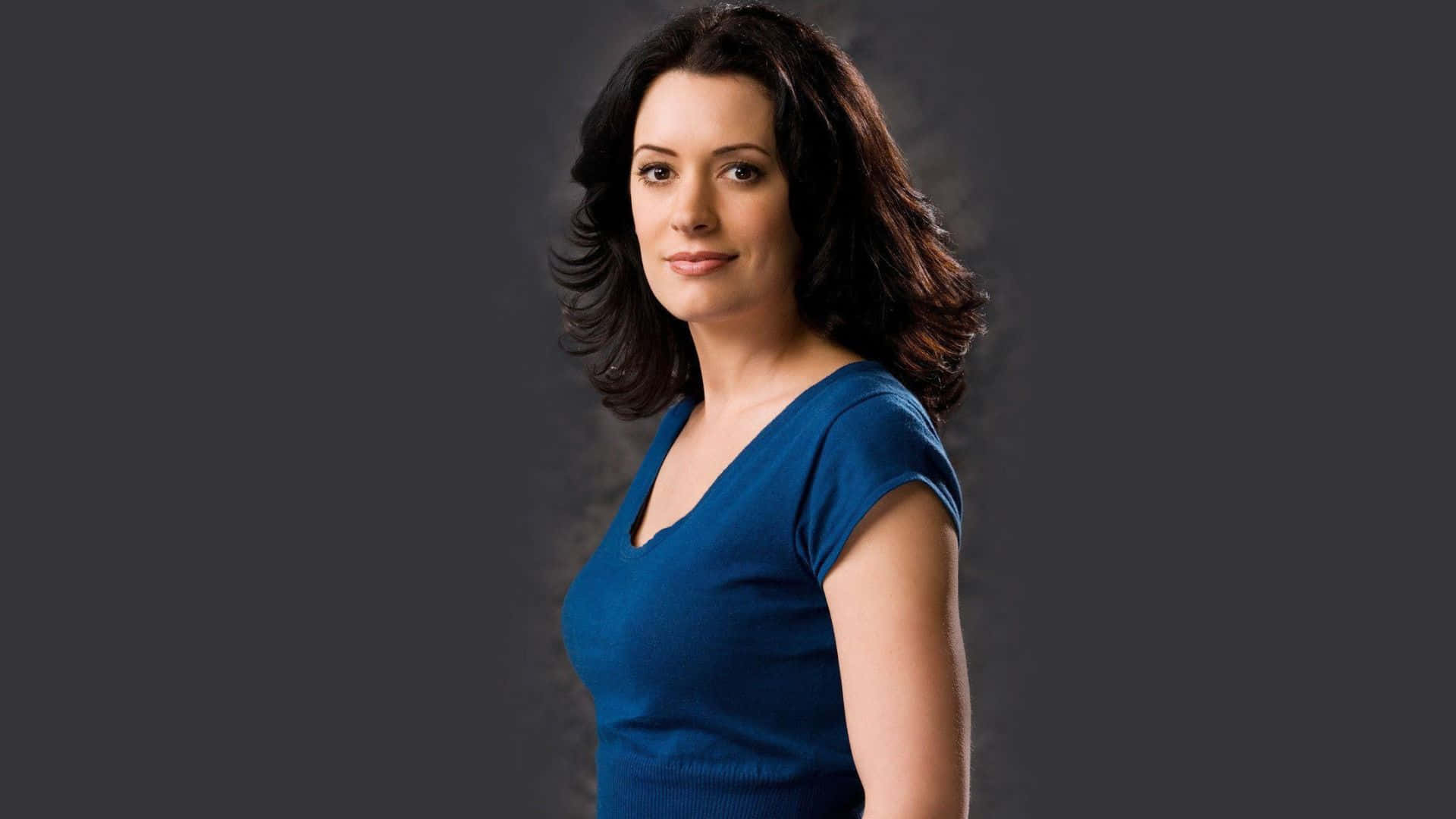 Paget Brewster, blue v-neck top, dark gray studio background, Full HD Desktop Wallpaper