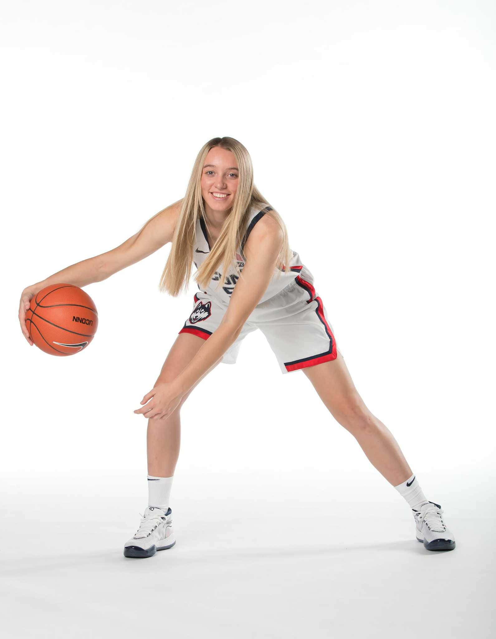 Paige Bueckers, white uniform with red trim, orange Spalding ball, Full HD Phone Wallpaper