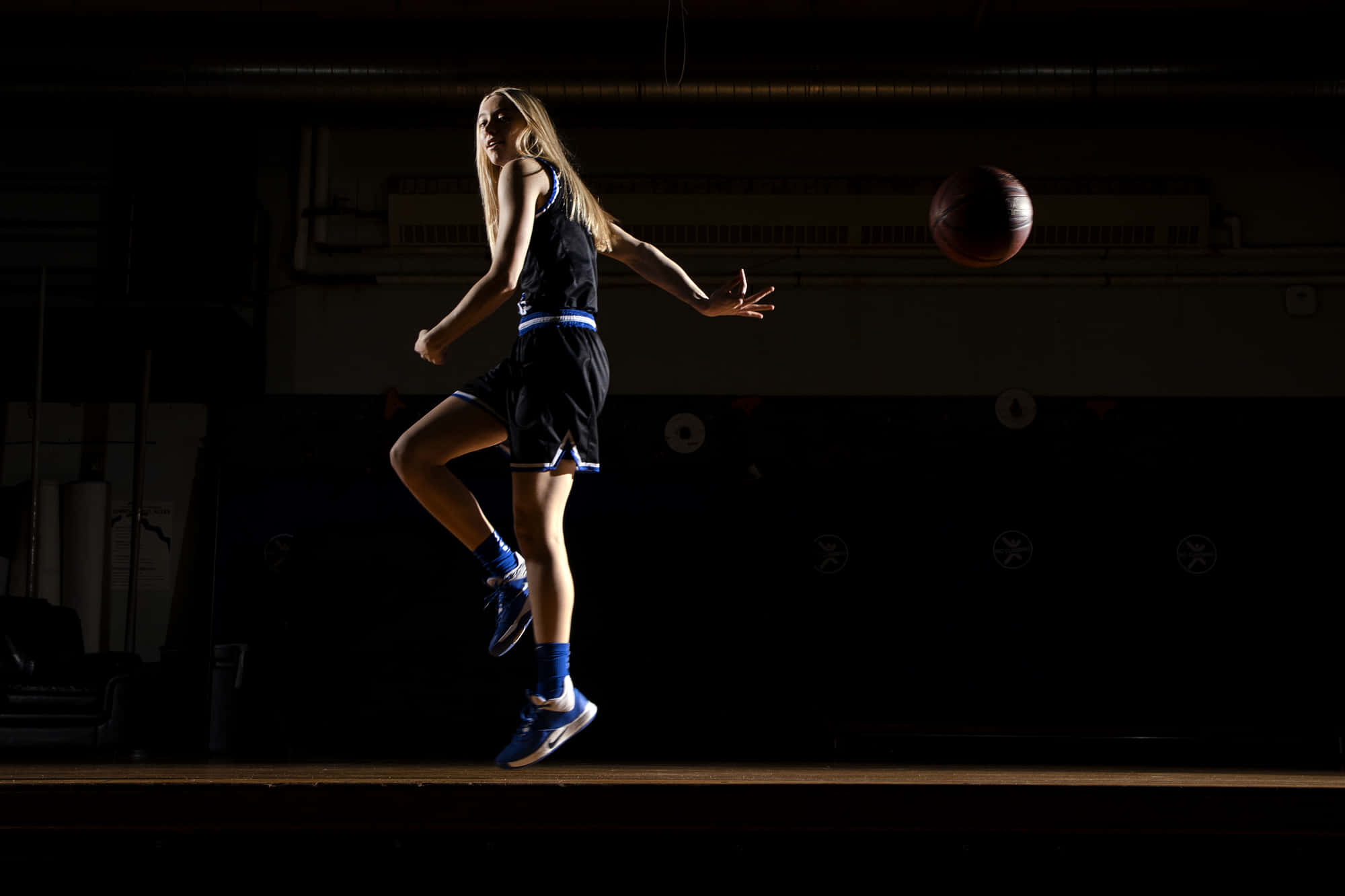 Paige Bueckers, dark gym, leaps midair, Full HD Desktop Wallpaper