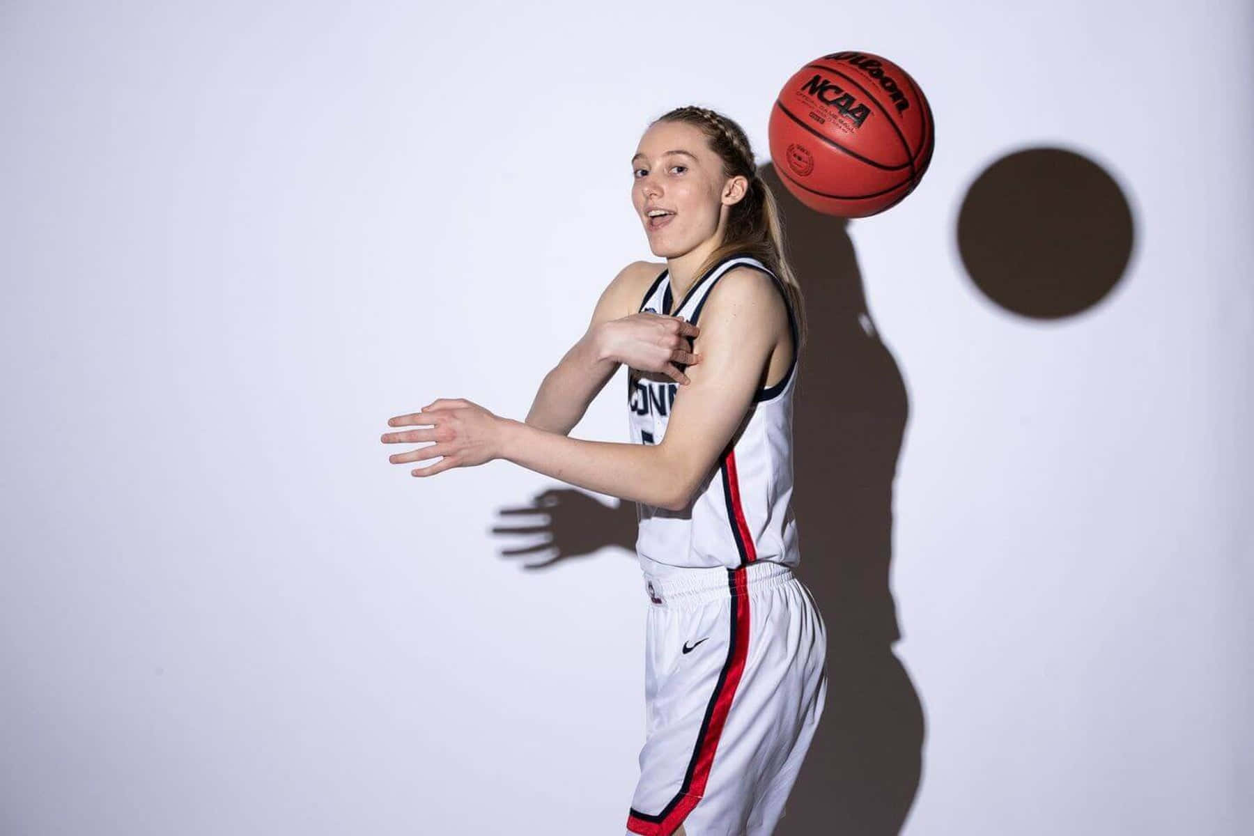 Paige Bueckers, white uniform, red NCAA basketball, HD Desktop Wallpaper
