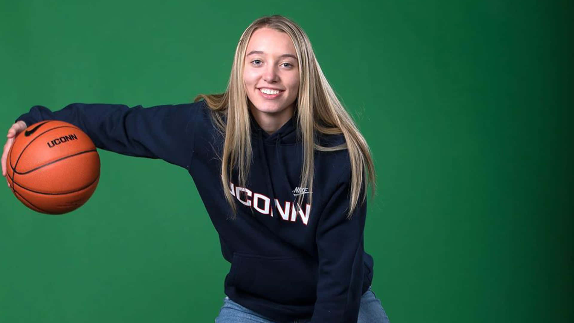 Paige Bueckers, navy UConn hoodie, orange basketball, Full HD Desktop Wallpaper