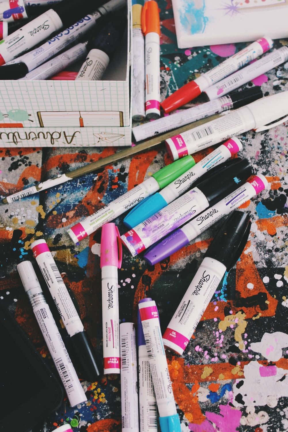 Sharpie markers, paint-splattered art surface, notebook, HD Phone Wallpaper