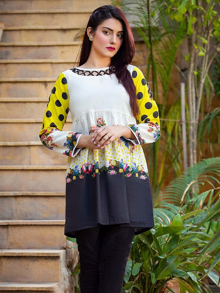 Pakistani Girl, vibrant yellow polka-dot and floral tunic, stone steps, SD Phone Wallpaper
