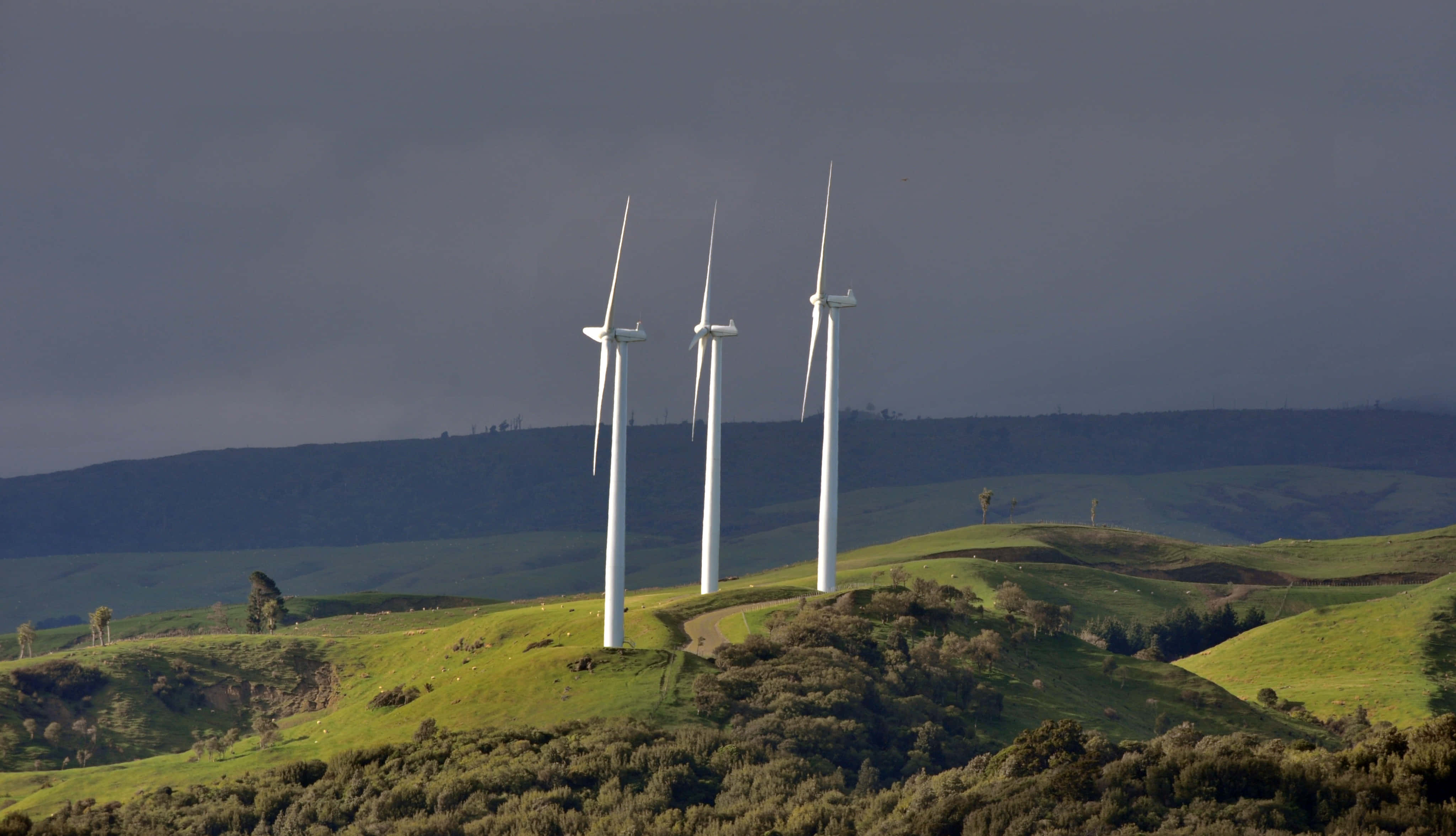 wind turbines, rolling green hills, cloudy sky, 4K Desktop Wallpaper