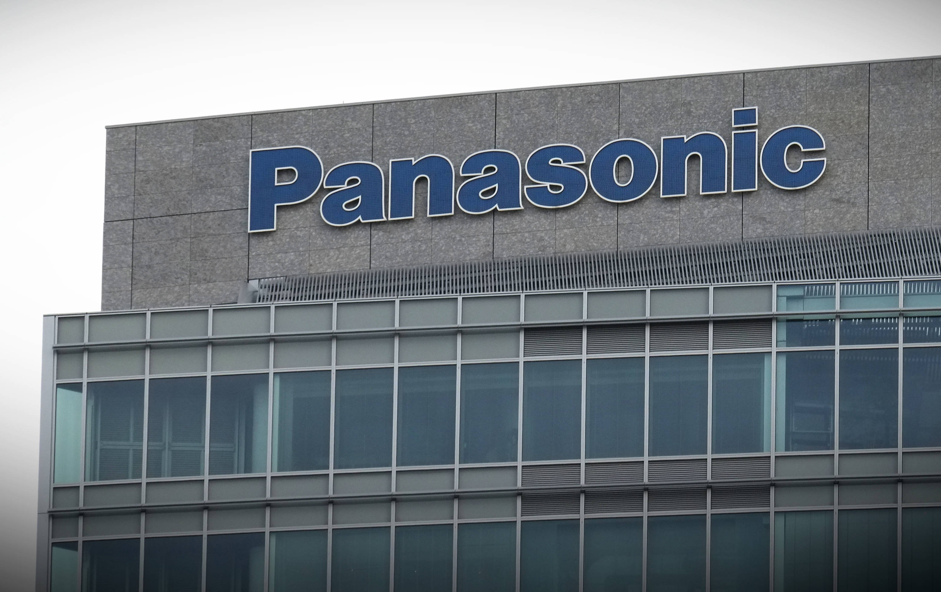 Panasonic, grey building, blue Panasonic sign, 2K Desktop Wallpaper