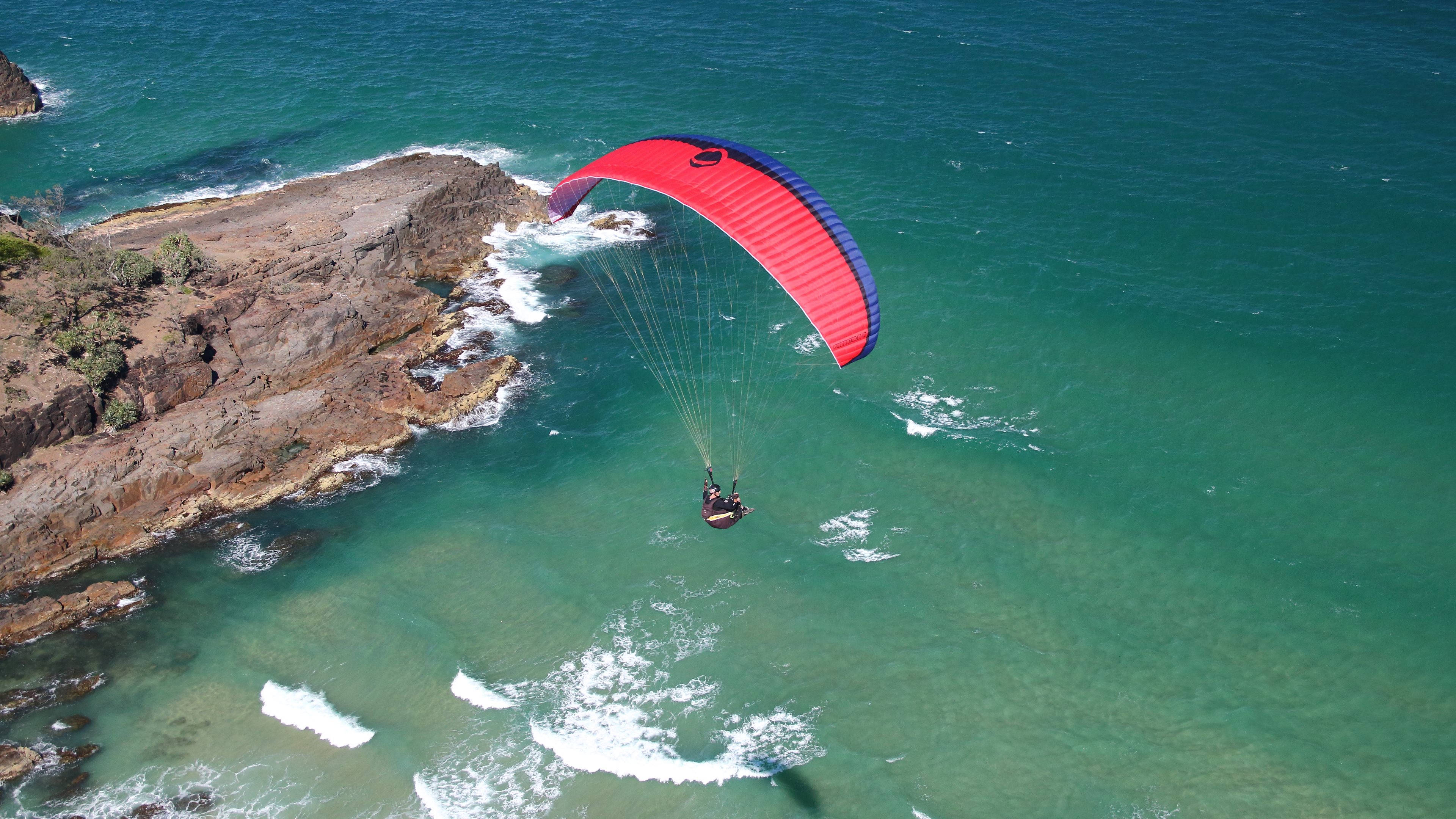 paragliding, turquoise waters, rugged coastal cliffs, 4K Desktop Wallpaper