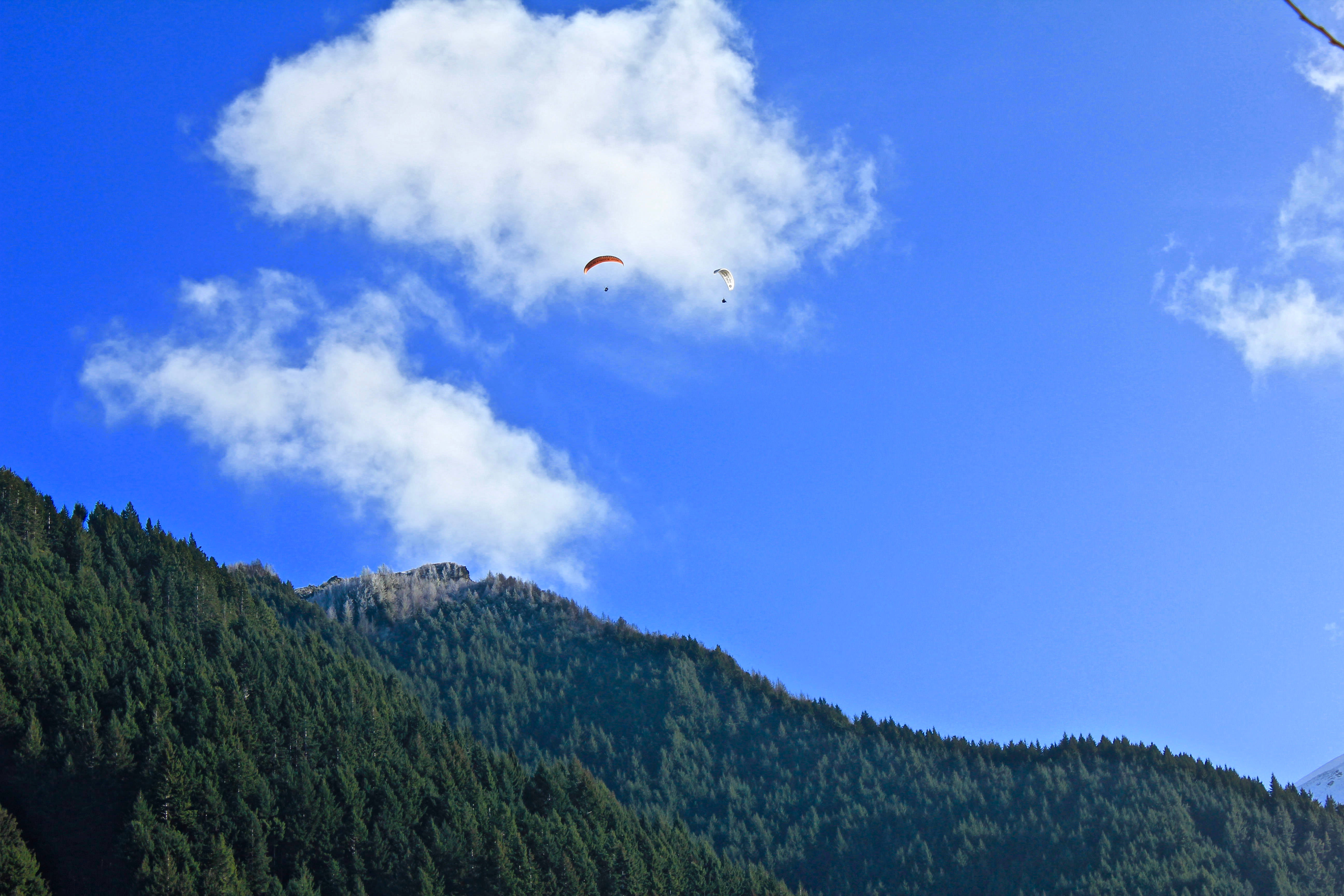 paragliding, steep mountains, lush green mountain range, 5K Desktop Wallpaper