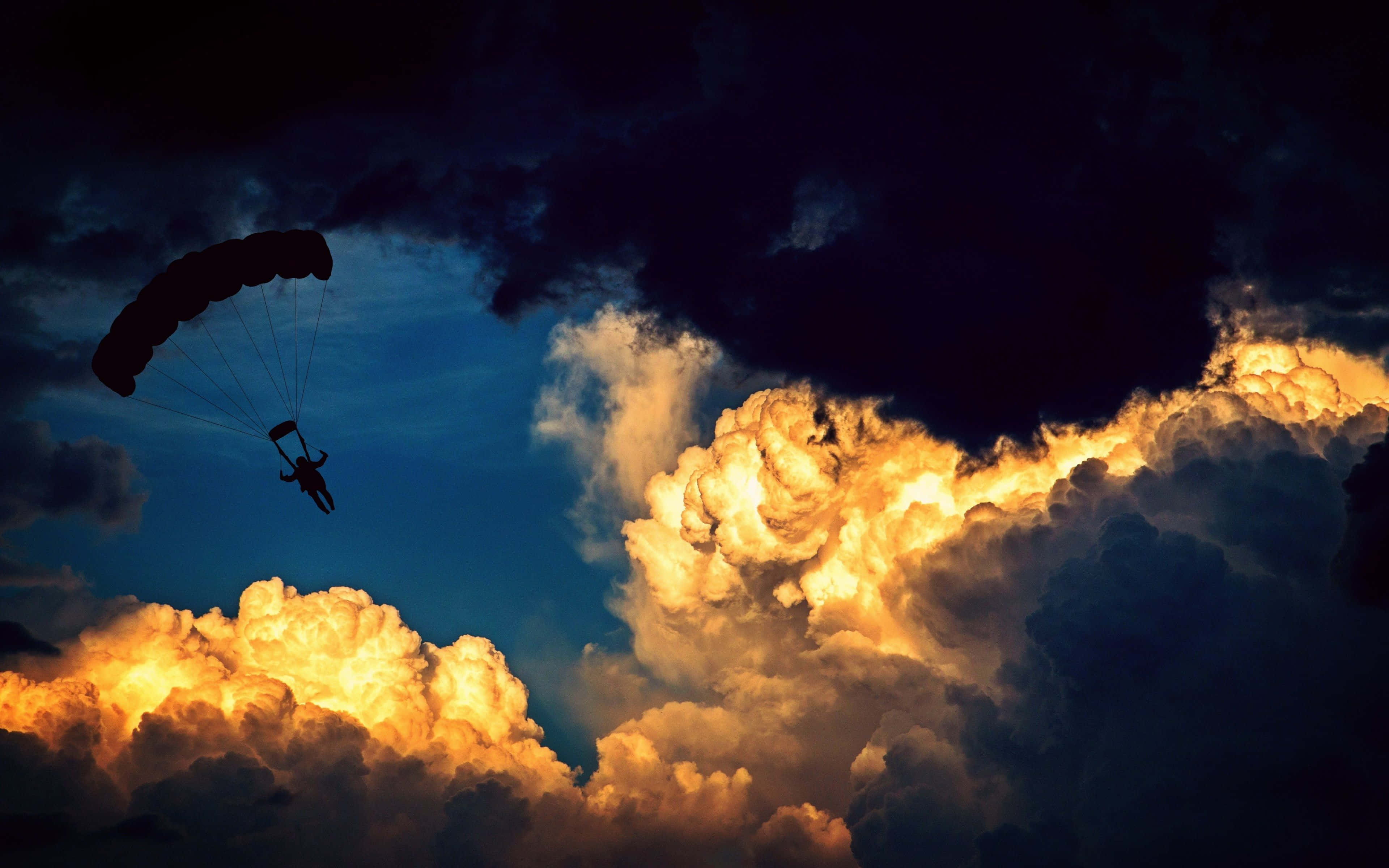Paragliding, fiery orange clouds, deep blue twilight, 4K Desktop Wallpaper