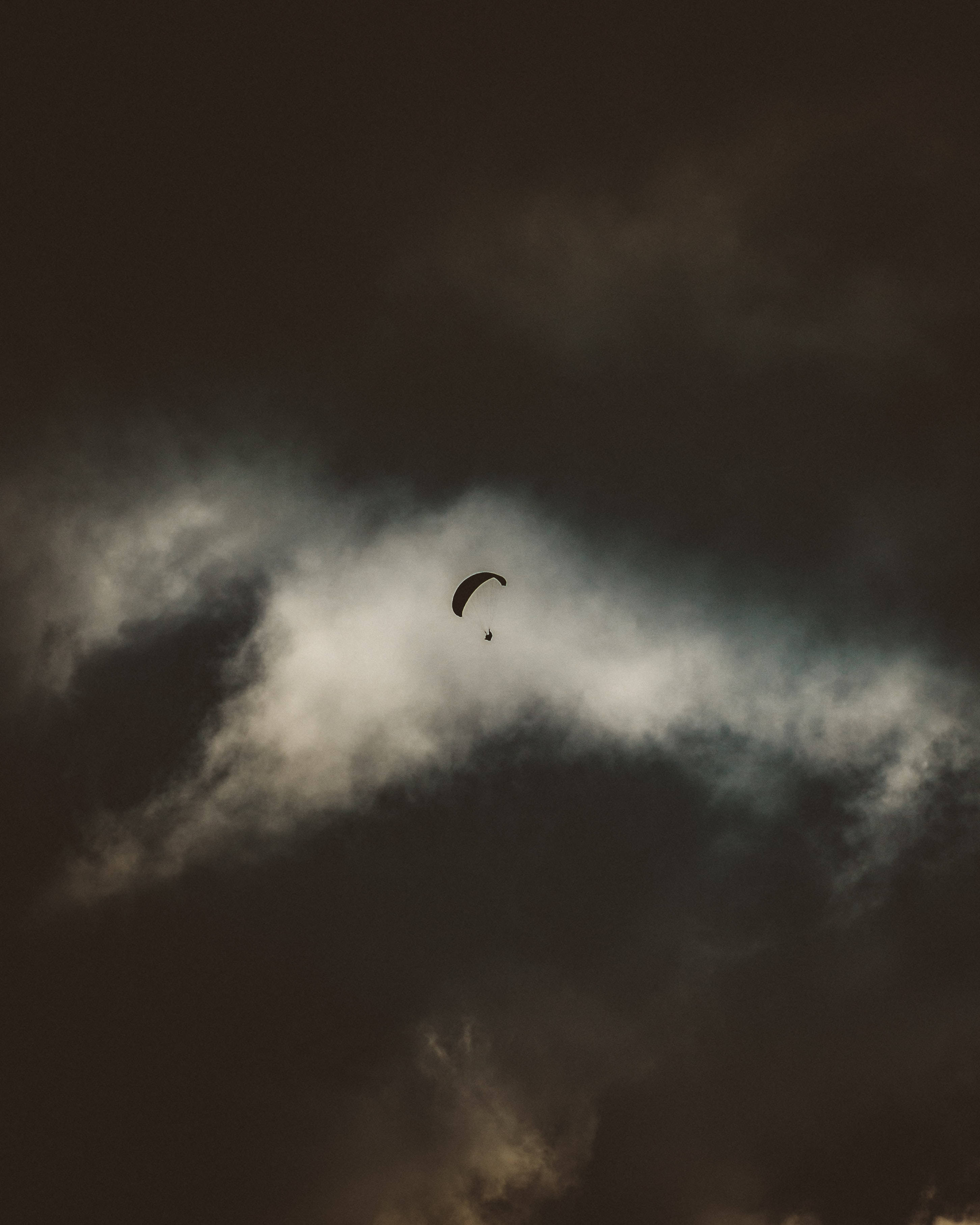 paragliding, dark sky, dark clouds, 2K Phone Wallpaper
