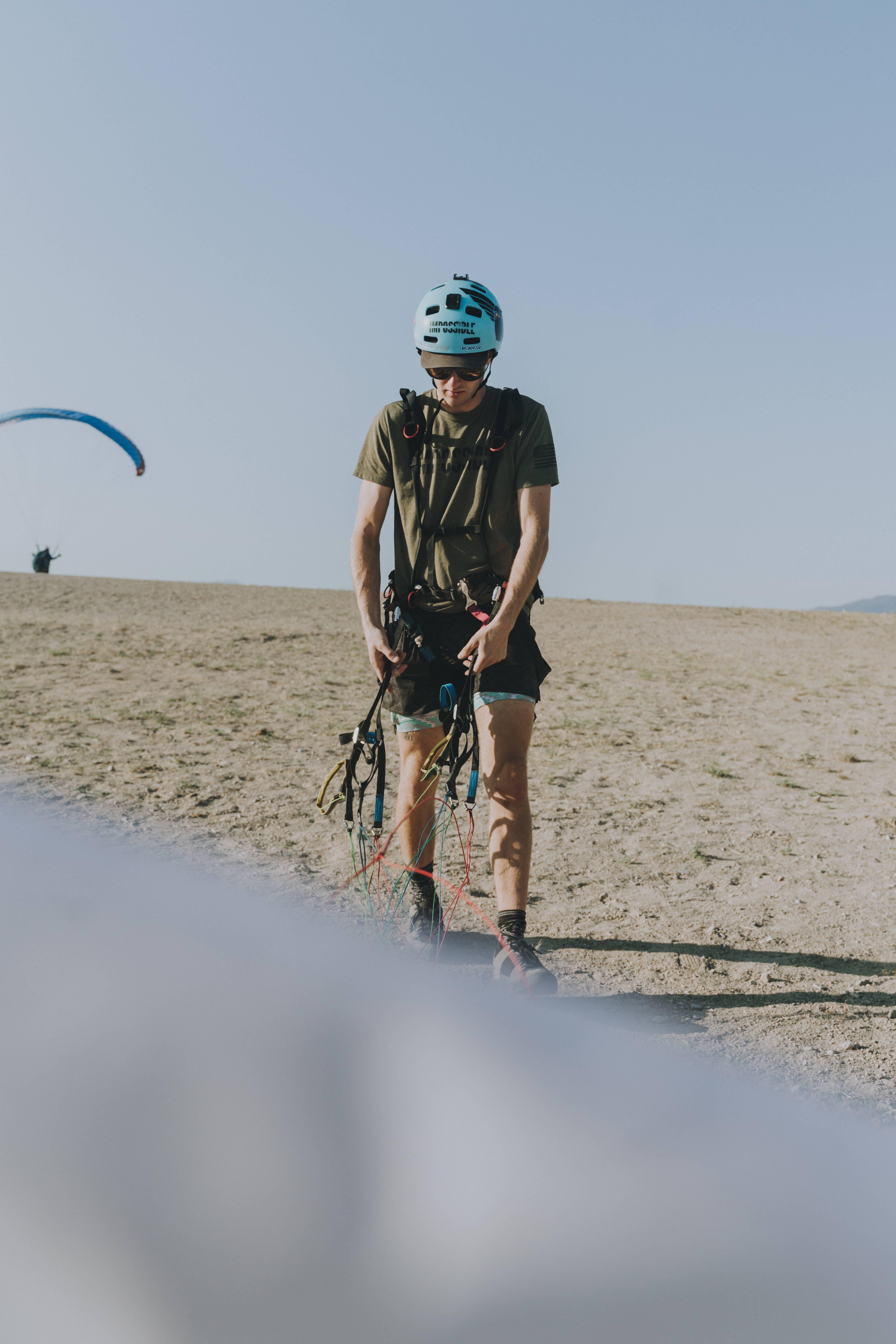 paragliding pilot equipment, paraglider, sandy plain, 5K Phone Wallpaper