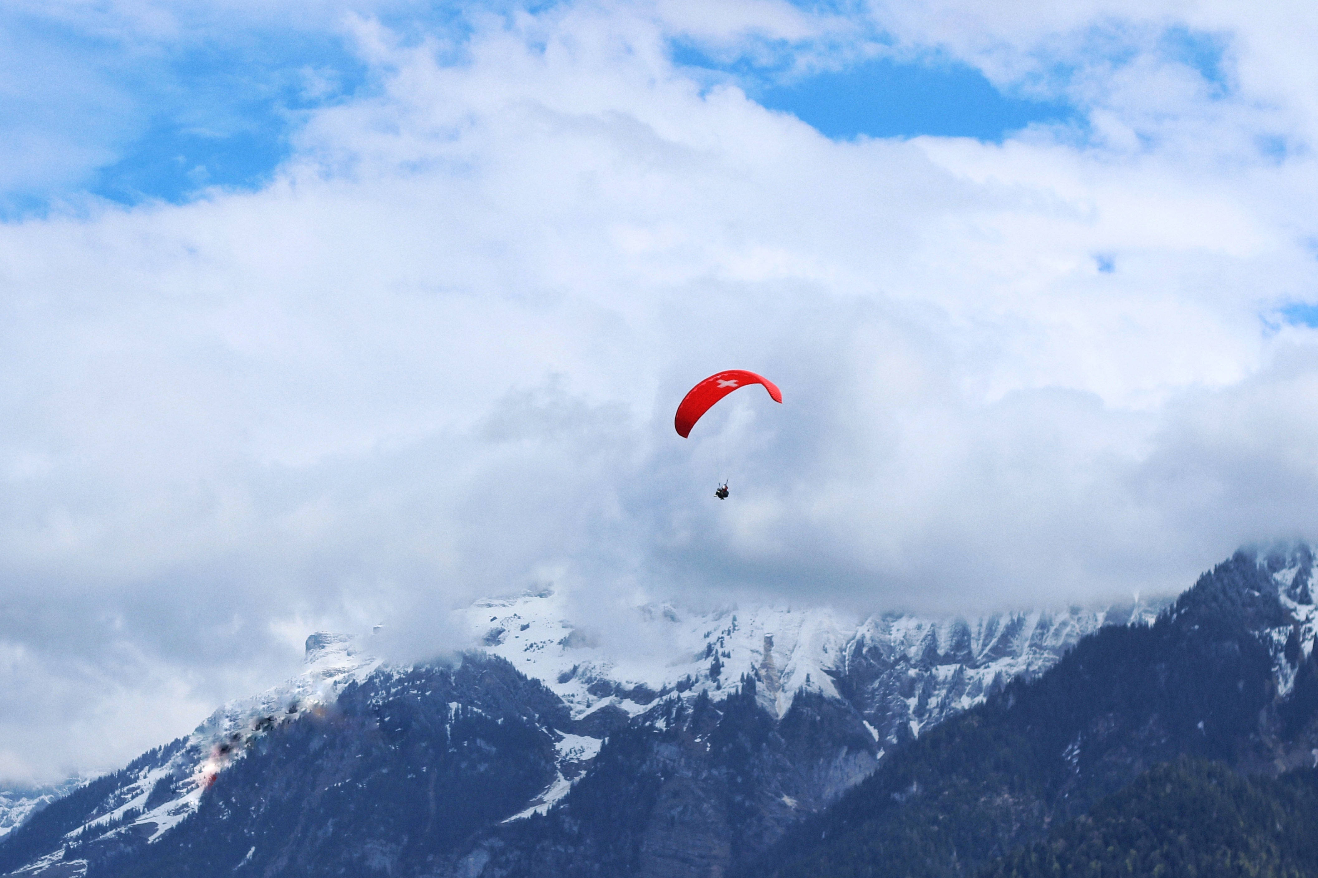paragliding, vibrant red paraglider, snowcapped mountains, 4K Desktop Wallpaper