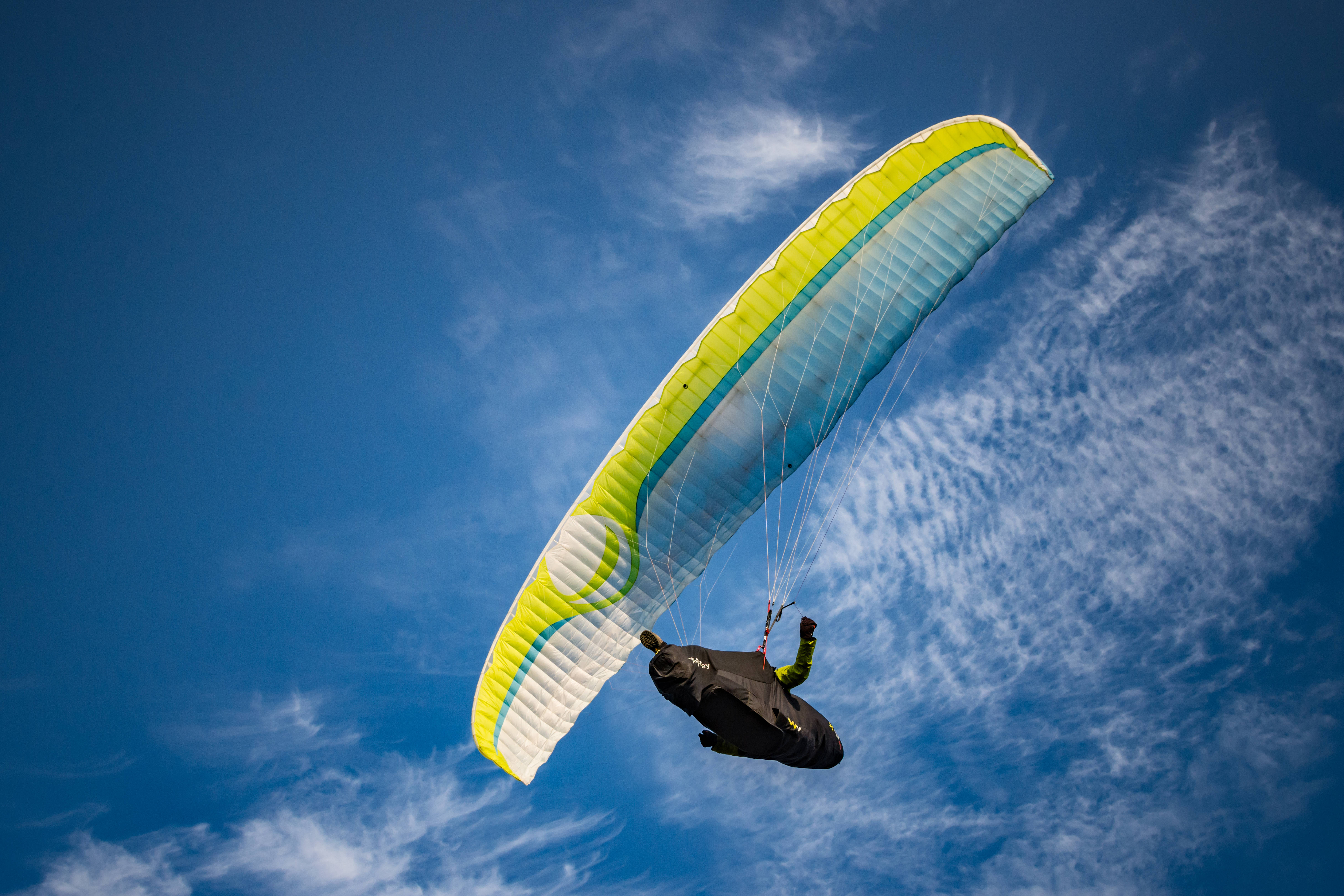 paraglider, vibrant blue sky, wispy white clouds, 5K Desktop Wallpaper