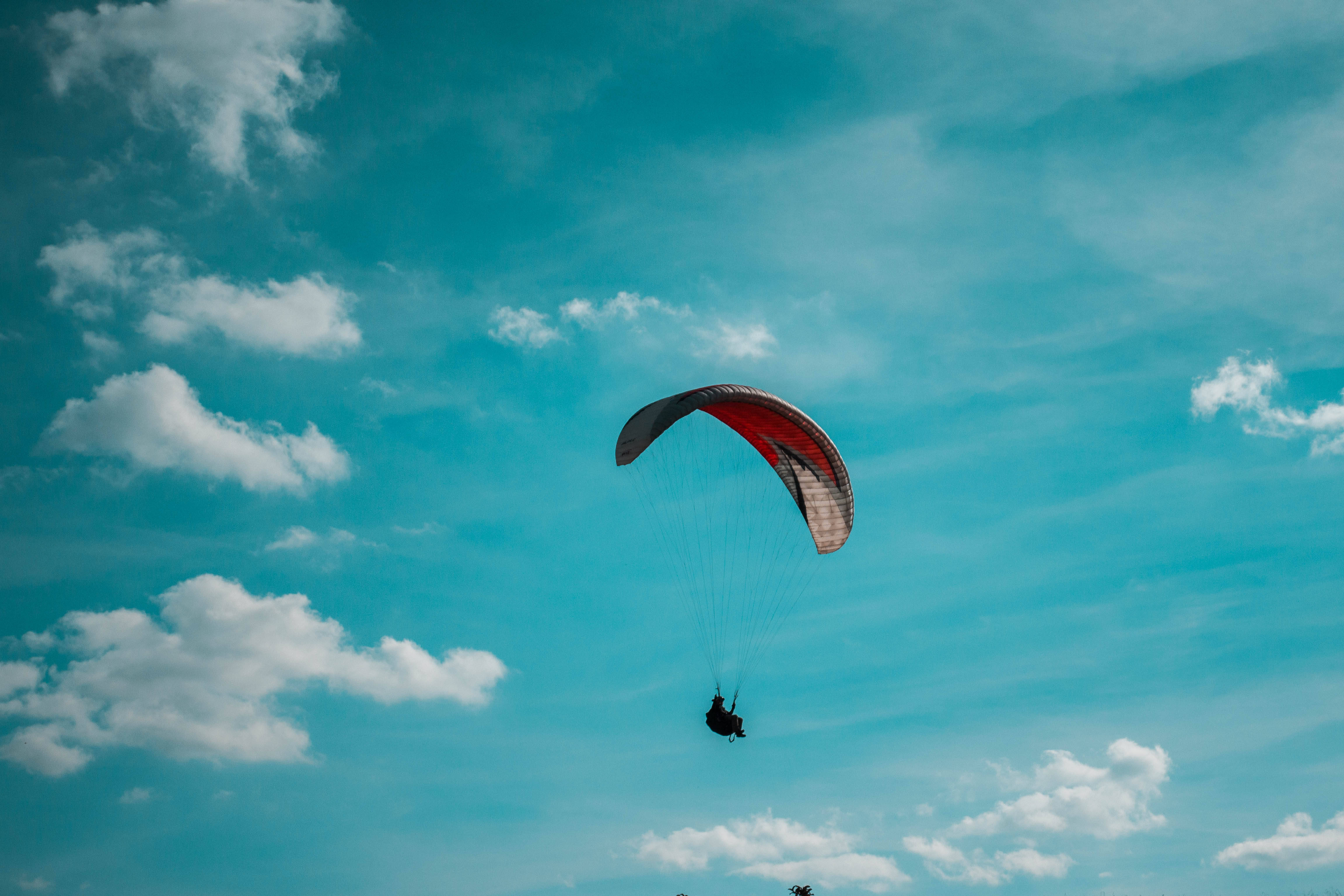 paraglider, red and gray canopy, vibrant blue sky, 4K Desktop Wallpaper