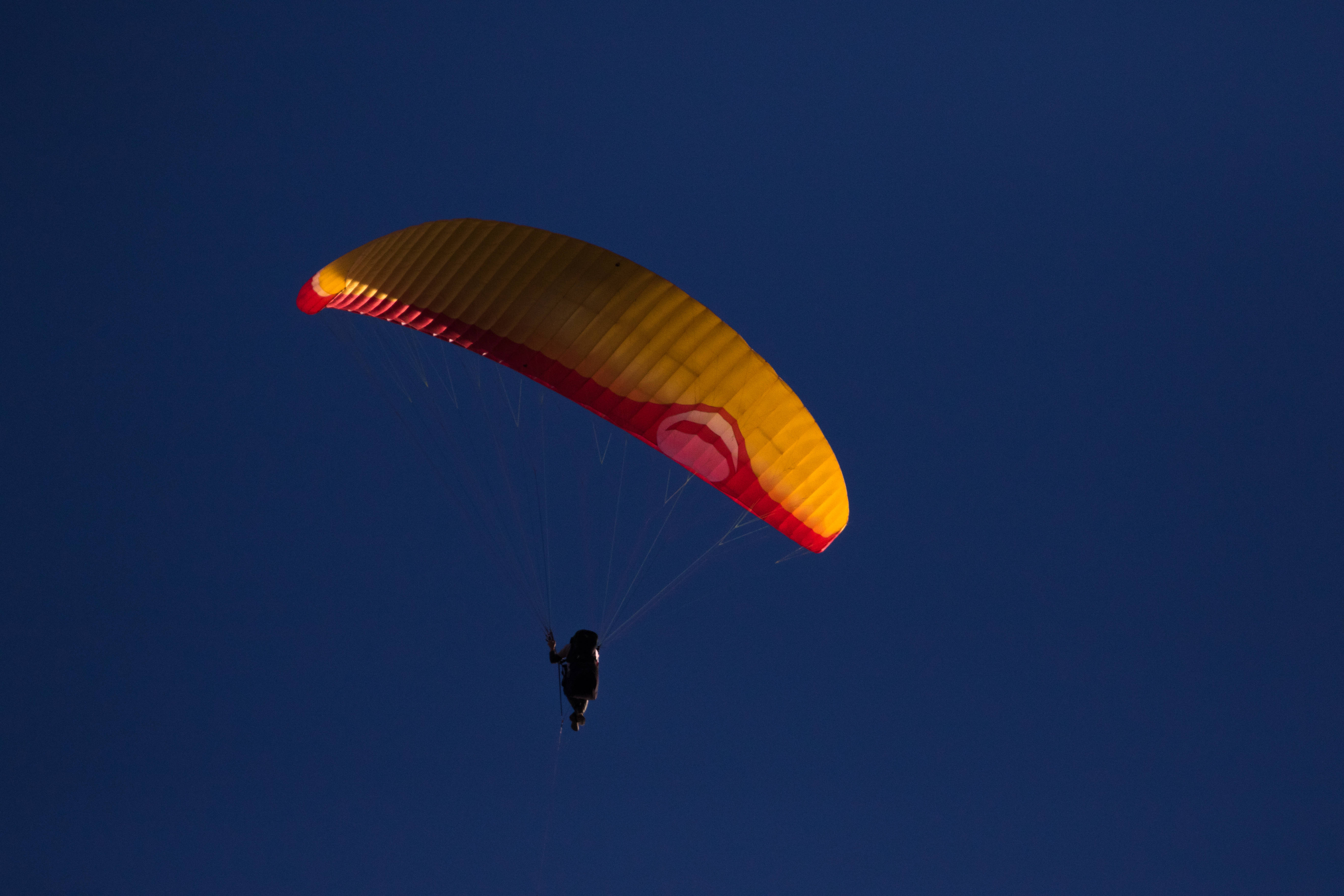 paragliding, night sky, vibrant yellow, 5K Desktop Wallpaper