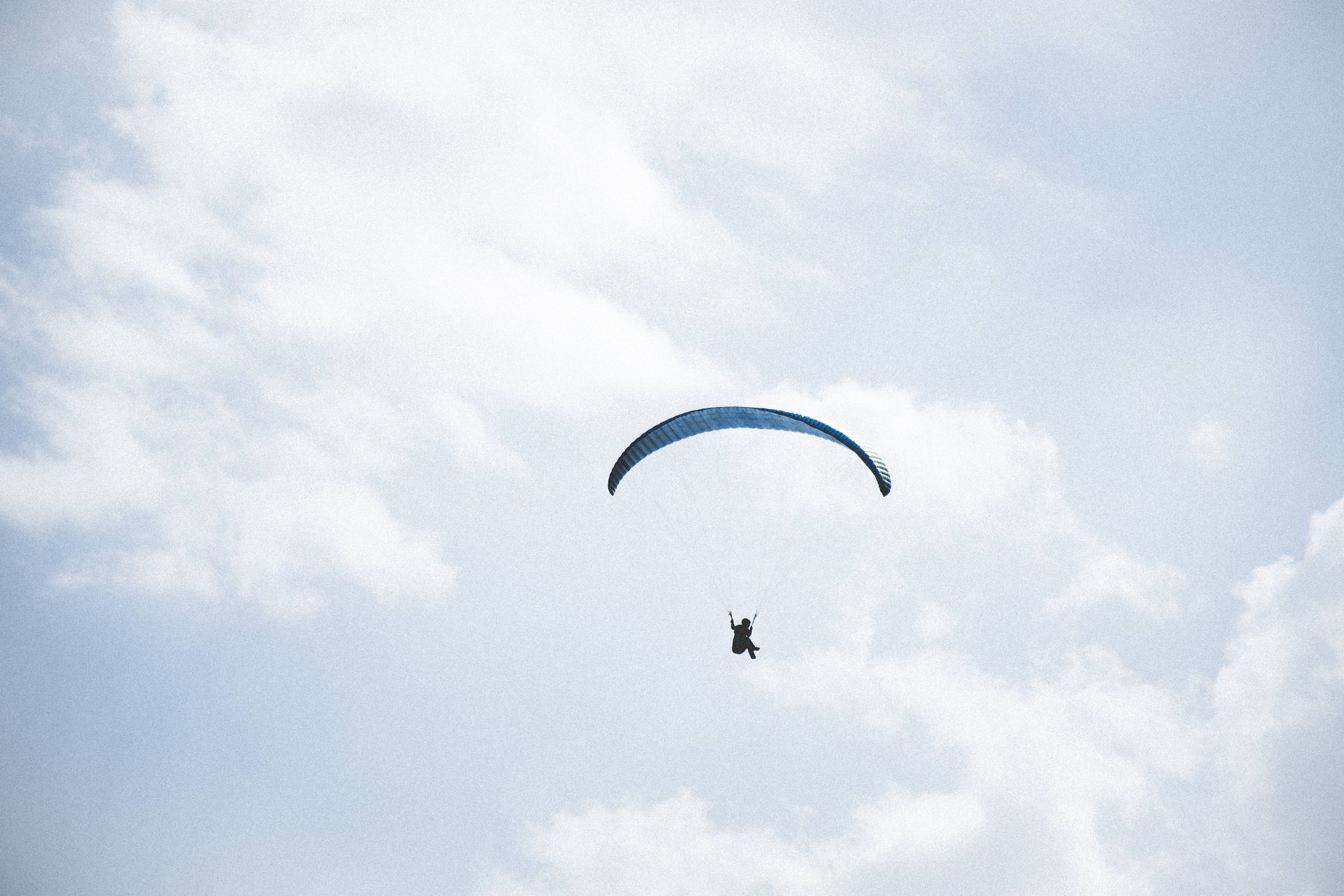 paragliding pilot, bright sky, soft white clouds, 5K Desktop Wallpaper