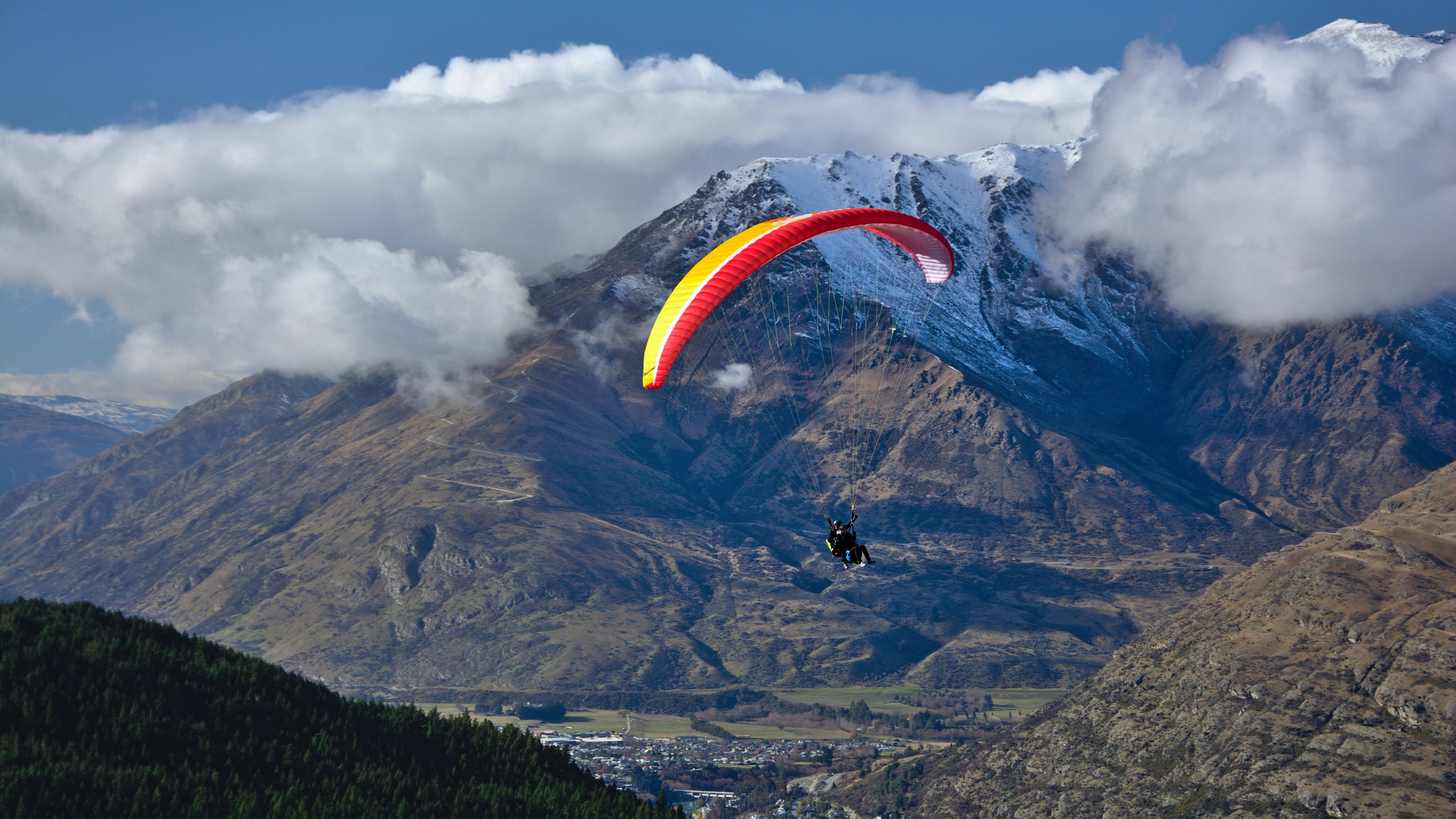 paragliding tandem, red and yellow paraglider, snow-capped mountains, 4K Desktop Wallpaper