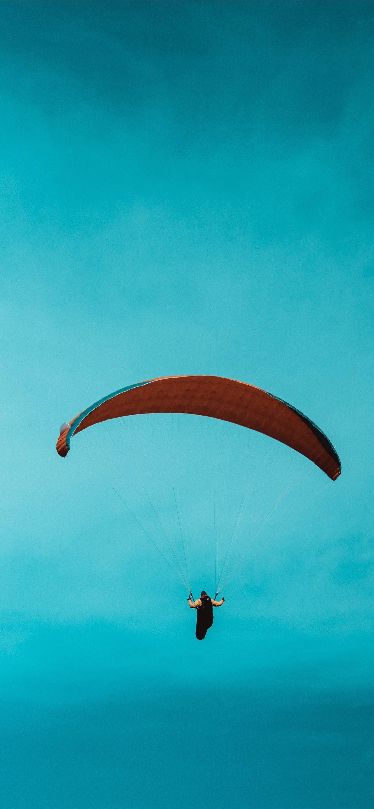 paraglider, teal sky, vibrant orange canopy, 2K Phone Wallpaper