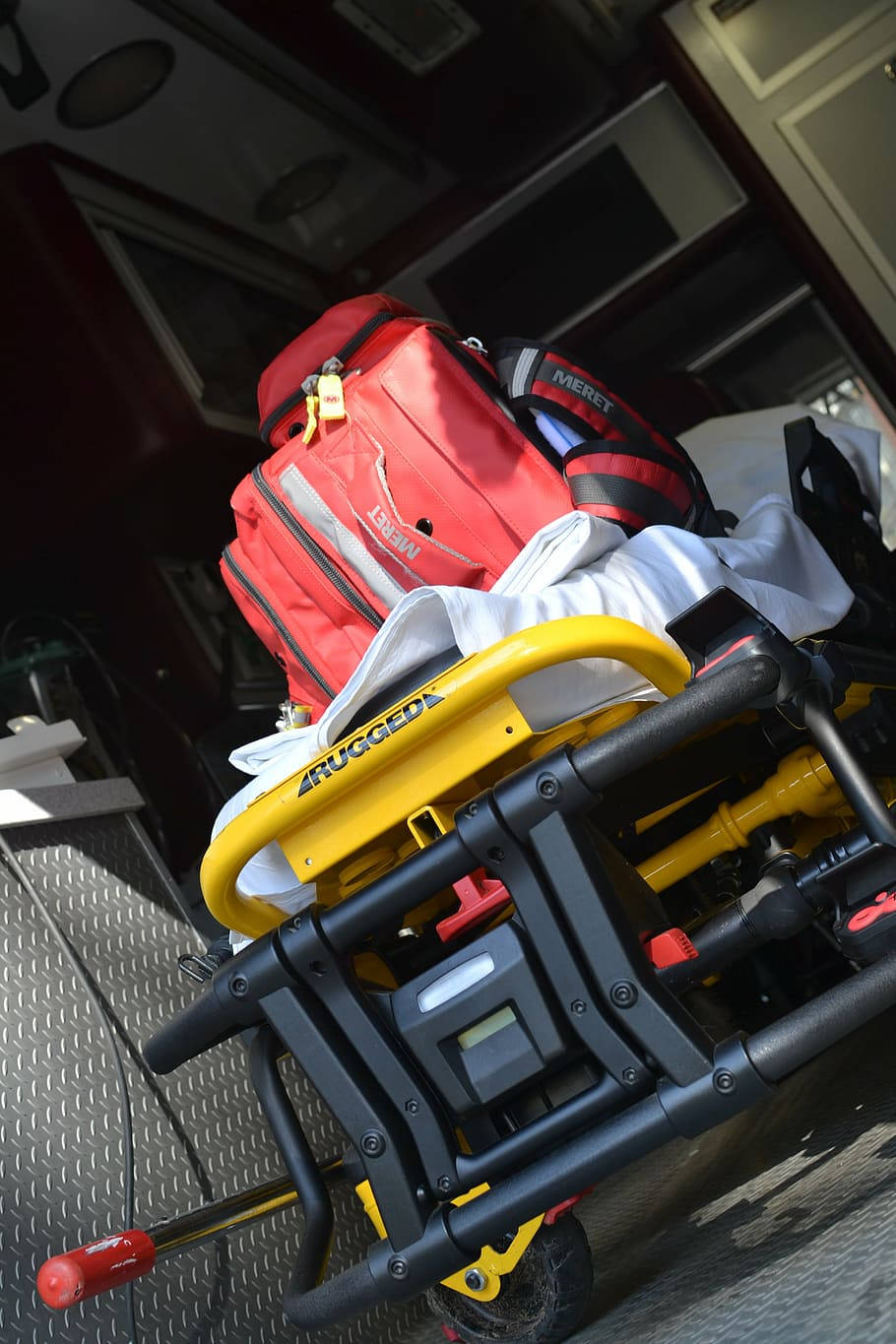 yellow and black medical stretcher, red gear, ambulance bay, HD Phone Wallpaper