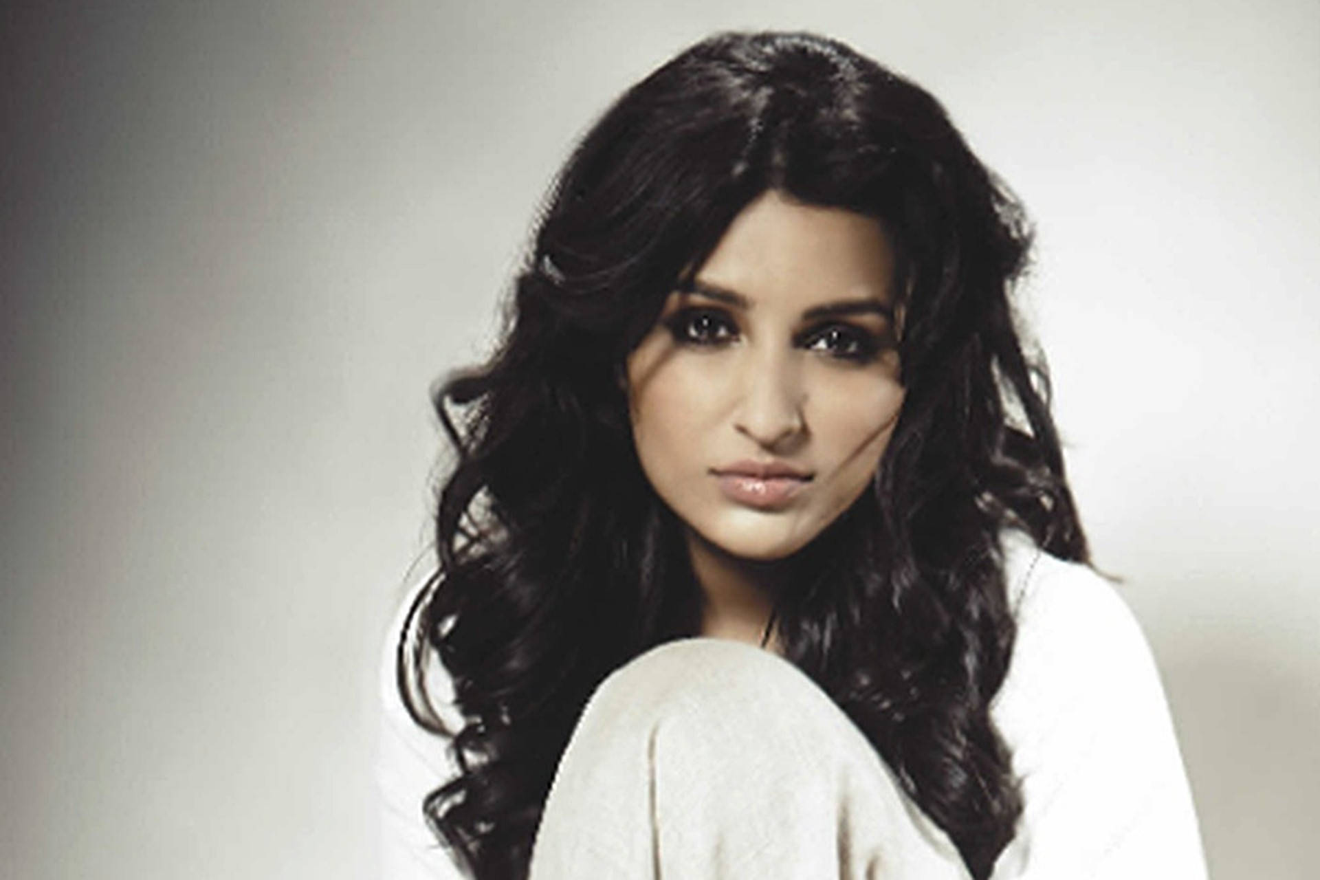 Parineeti Chopra, long dark wavy hair, soft gray studio background, Full HD Desktop Wallpaper