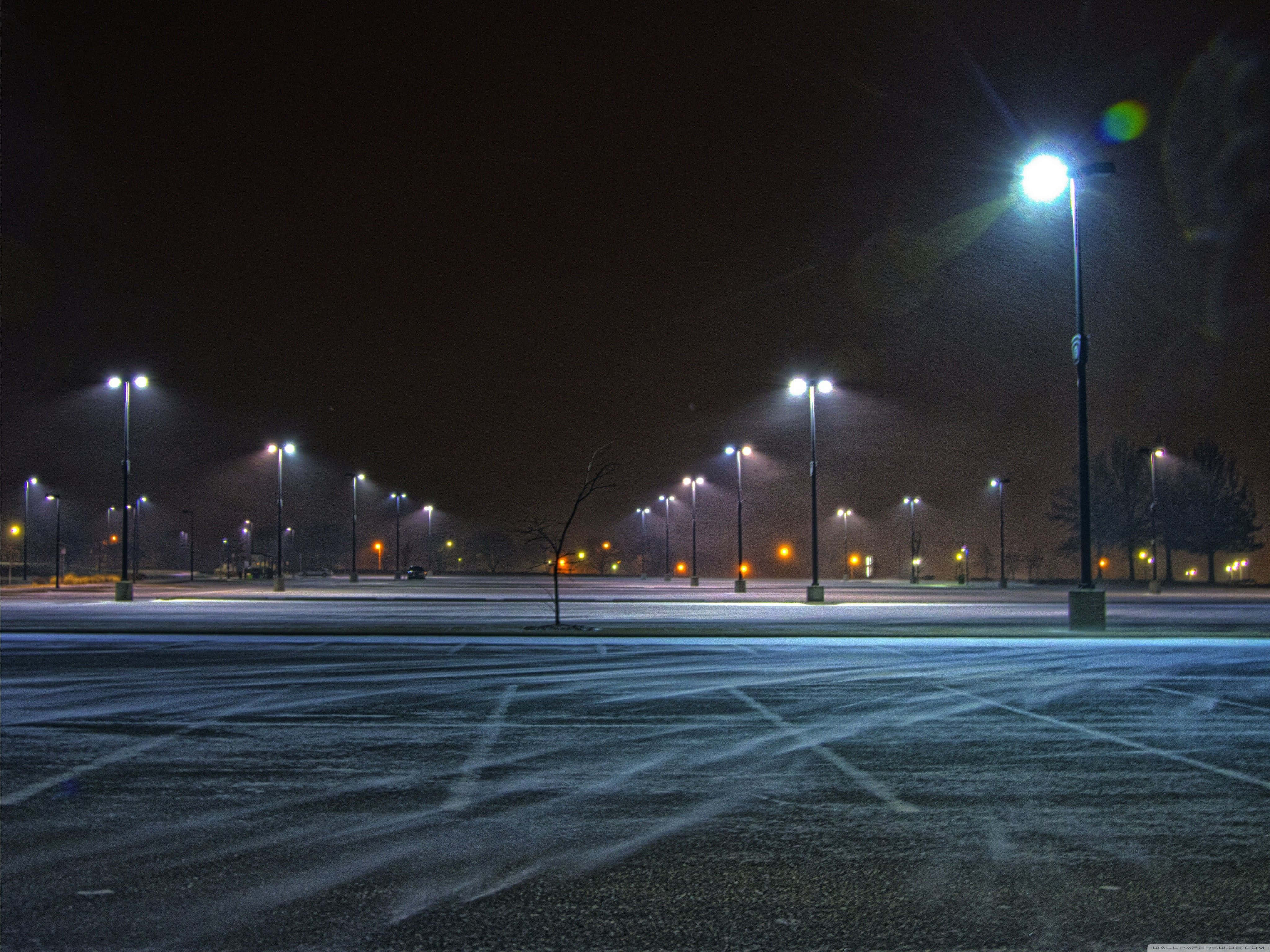 snow-covered parking lot, night, bright streetlights, 4K Desktop Wallpaper