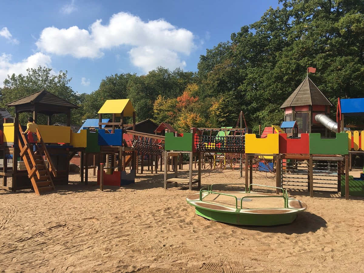 Colorful Playground Bettembourg Park, wooden structures, green boat swing set, SD Desktop Wallpaper