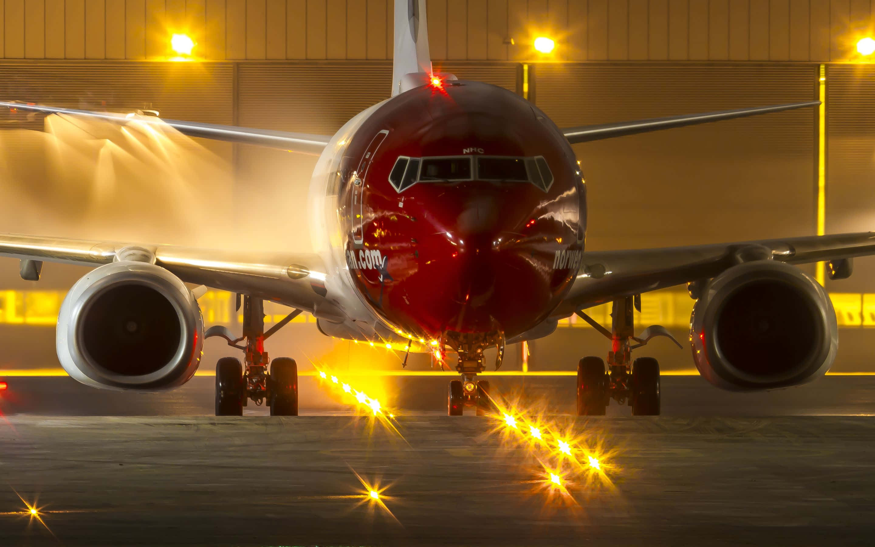 red airplane, night, bright yellow runway lights, 2K Desktop Wallpaper