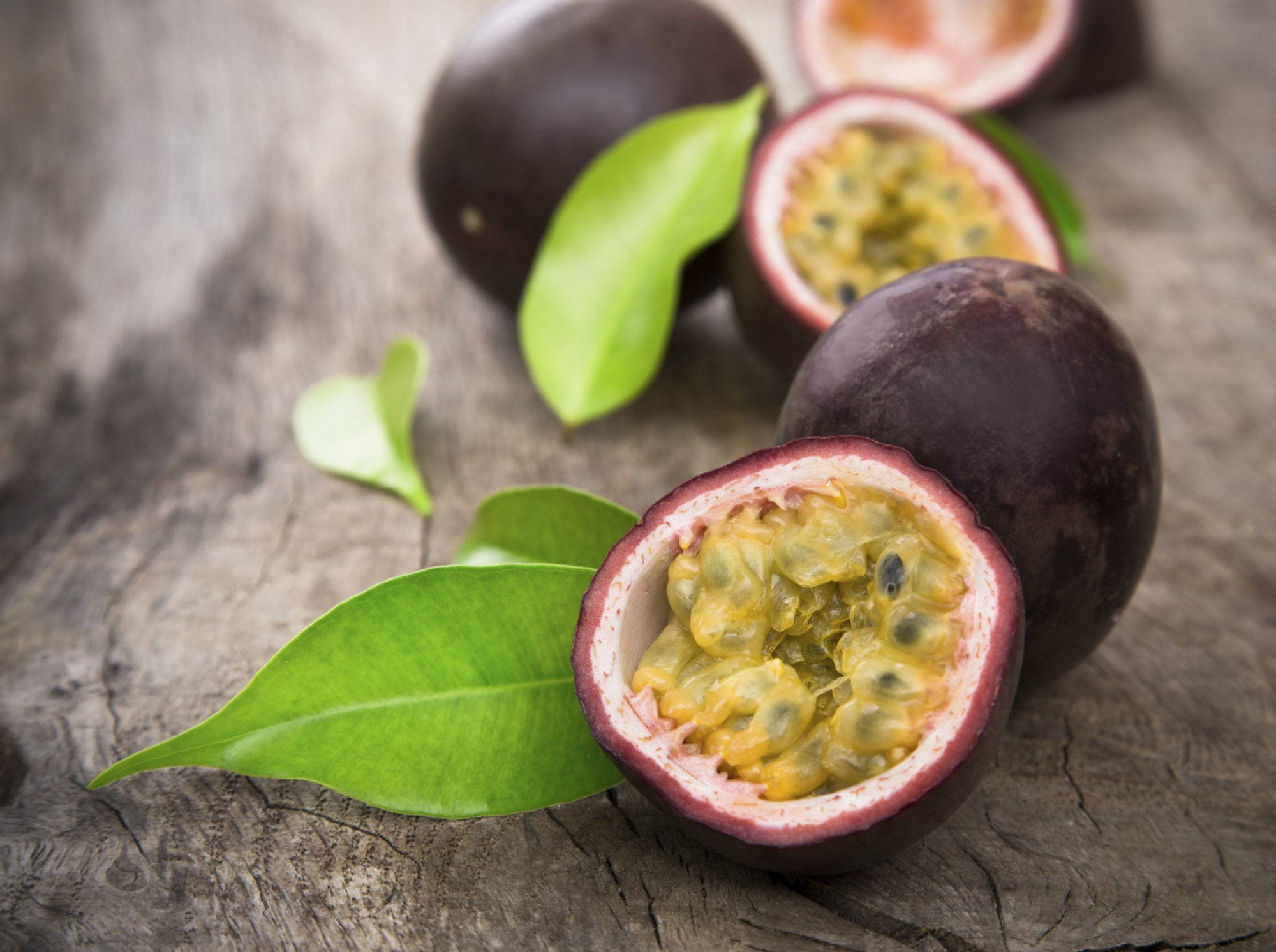 sliced fresh passion fruit, juicy yellow pulp, black seeds, Full HD Desktop Wallpaper