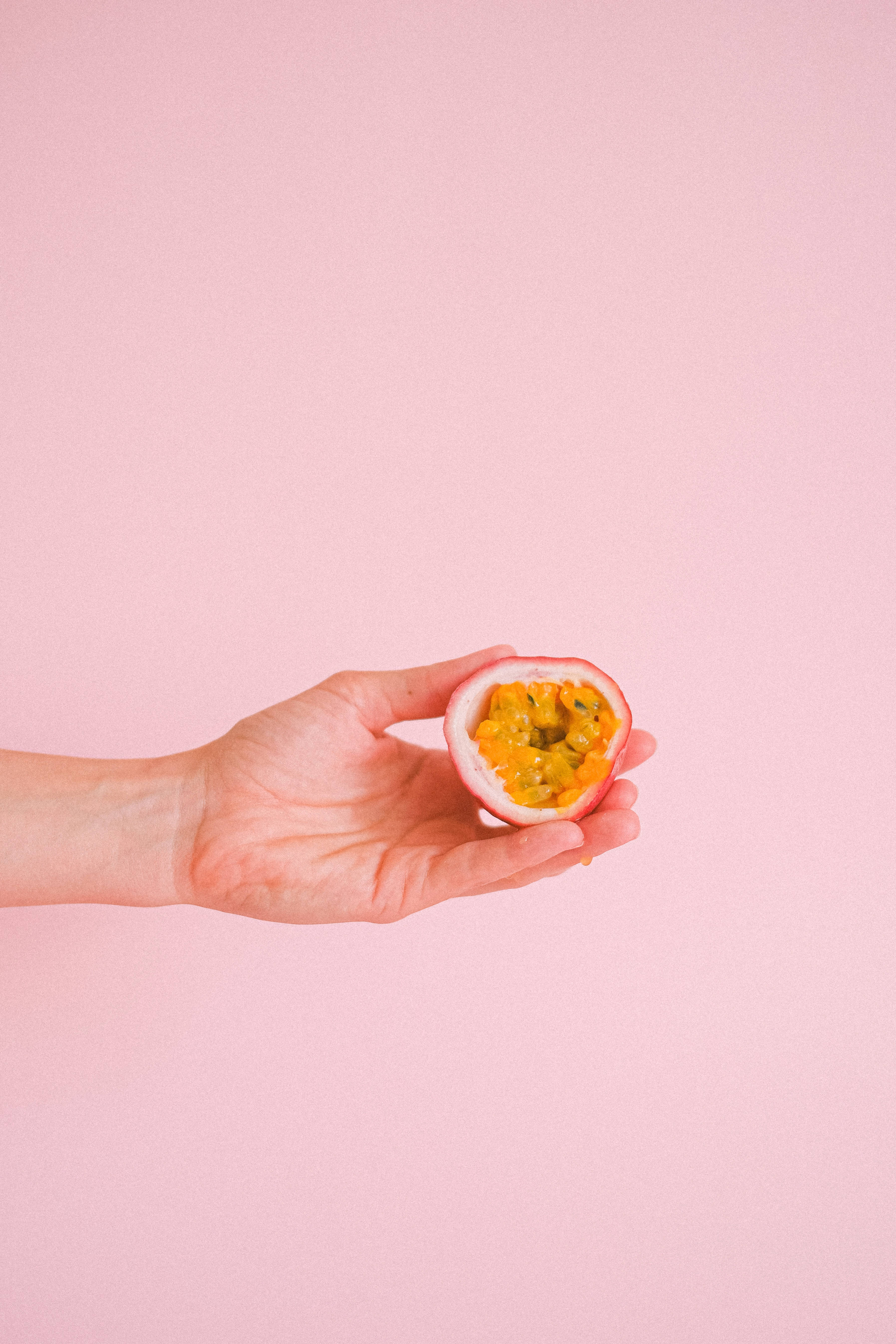 passion fruit, yellow pulp, black seeds, 5K Phone Wallpaper