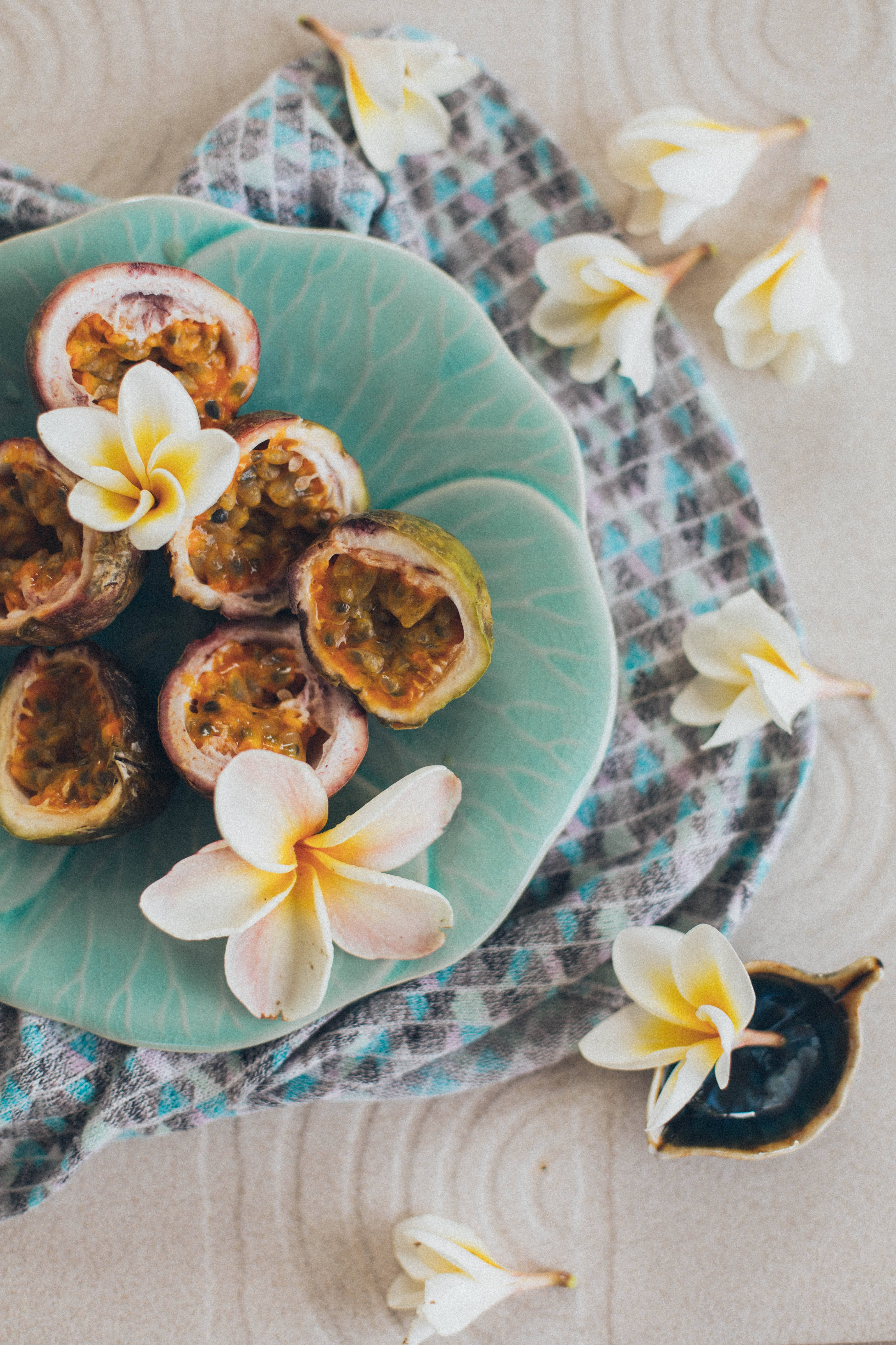 teal plate, halved passion fruits, plumeria flowers, 5K Phone Wallpaper