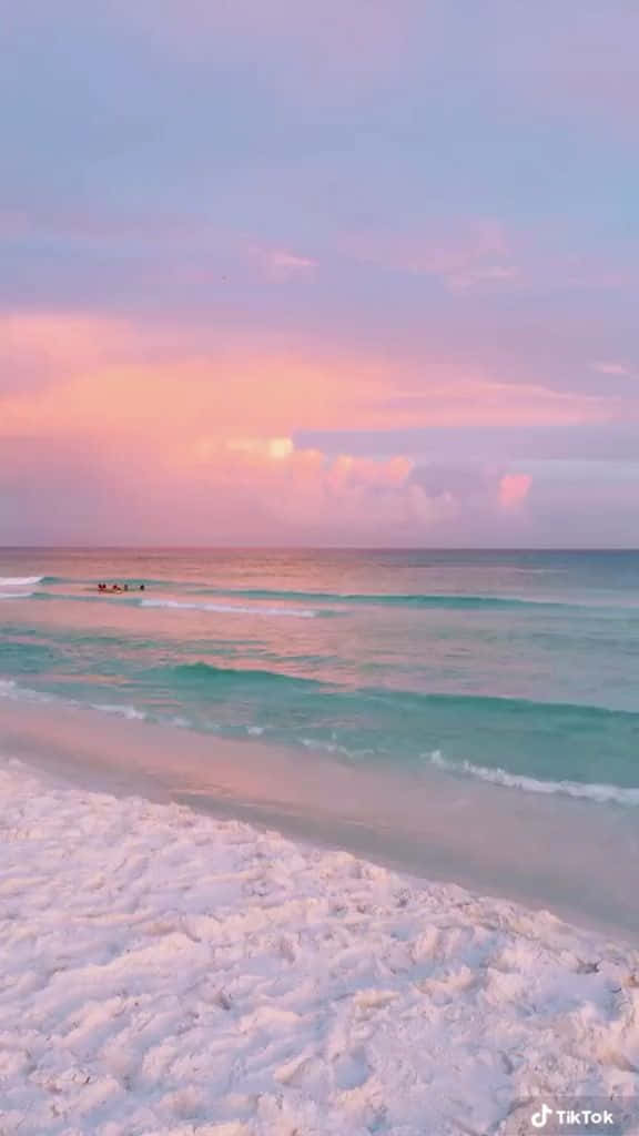 pastel beach, soft pink and purple sunset, turquoise ocean, SD Phone Wallpaper