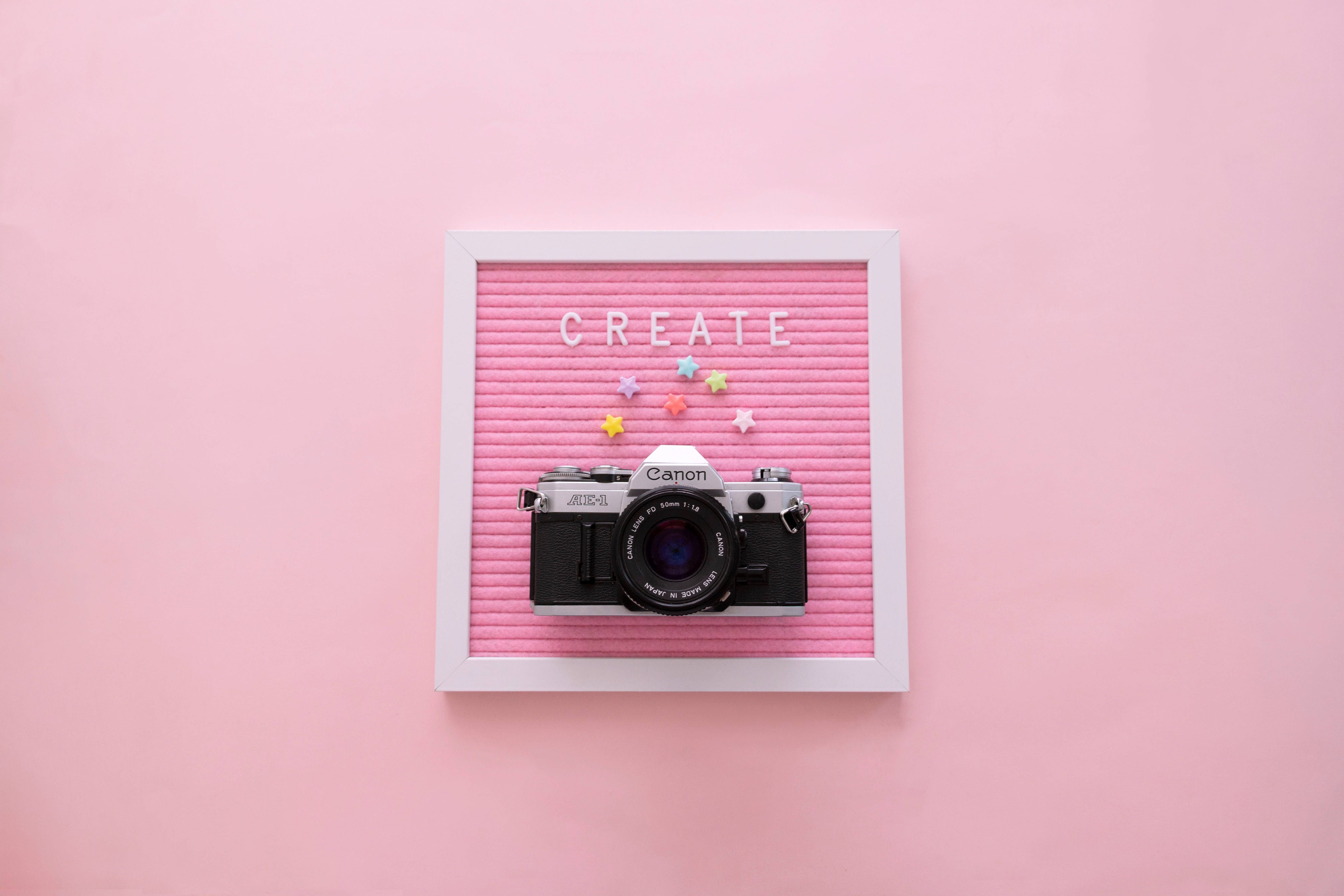 vintage Canon camera, pink felt board, white frame, 5K Desktop Wallpaper