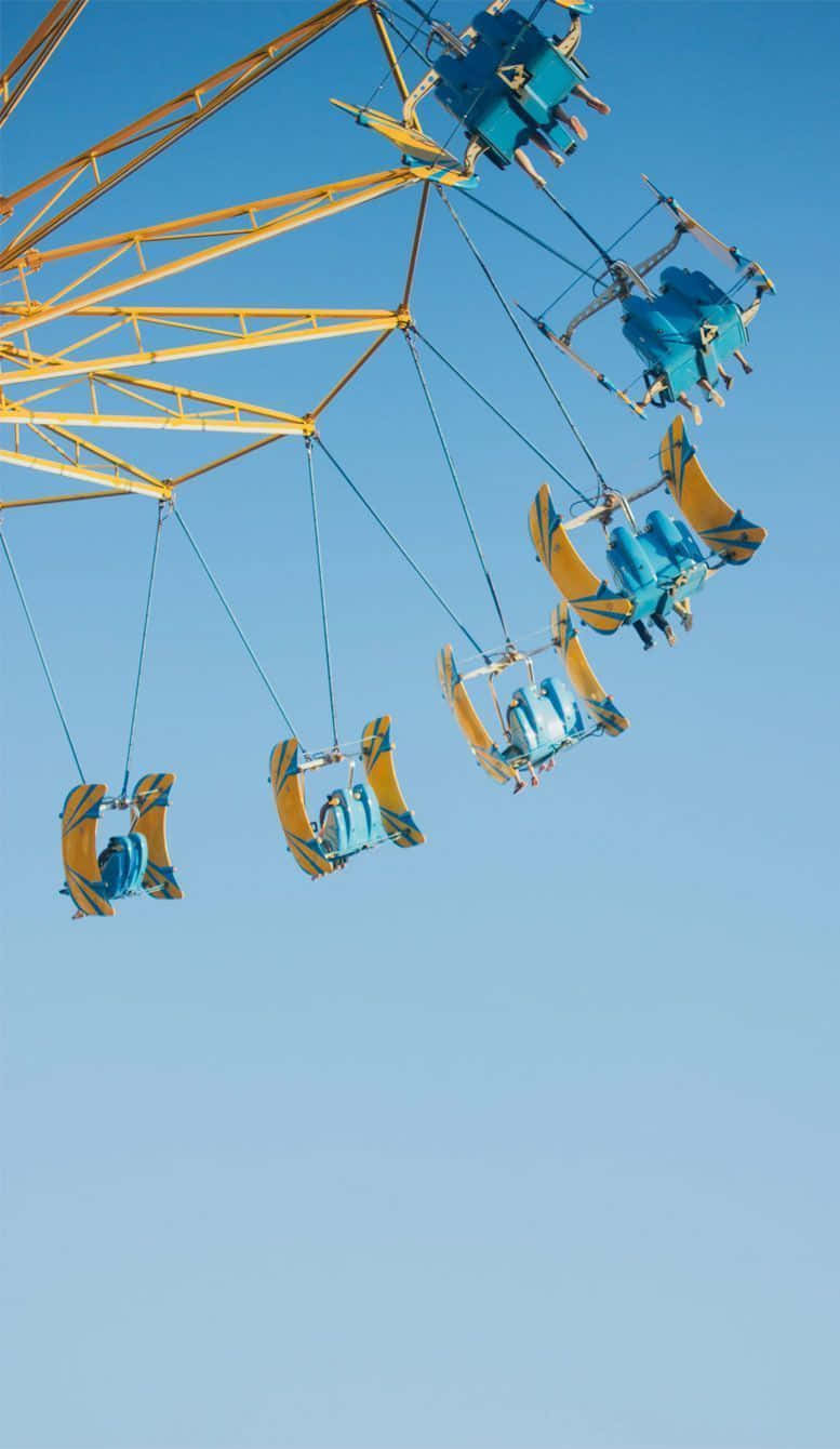 pastel summer, vibrant yellow, blue swinging carnival ride, HD Phone Wallpaper