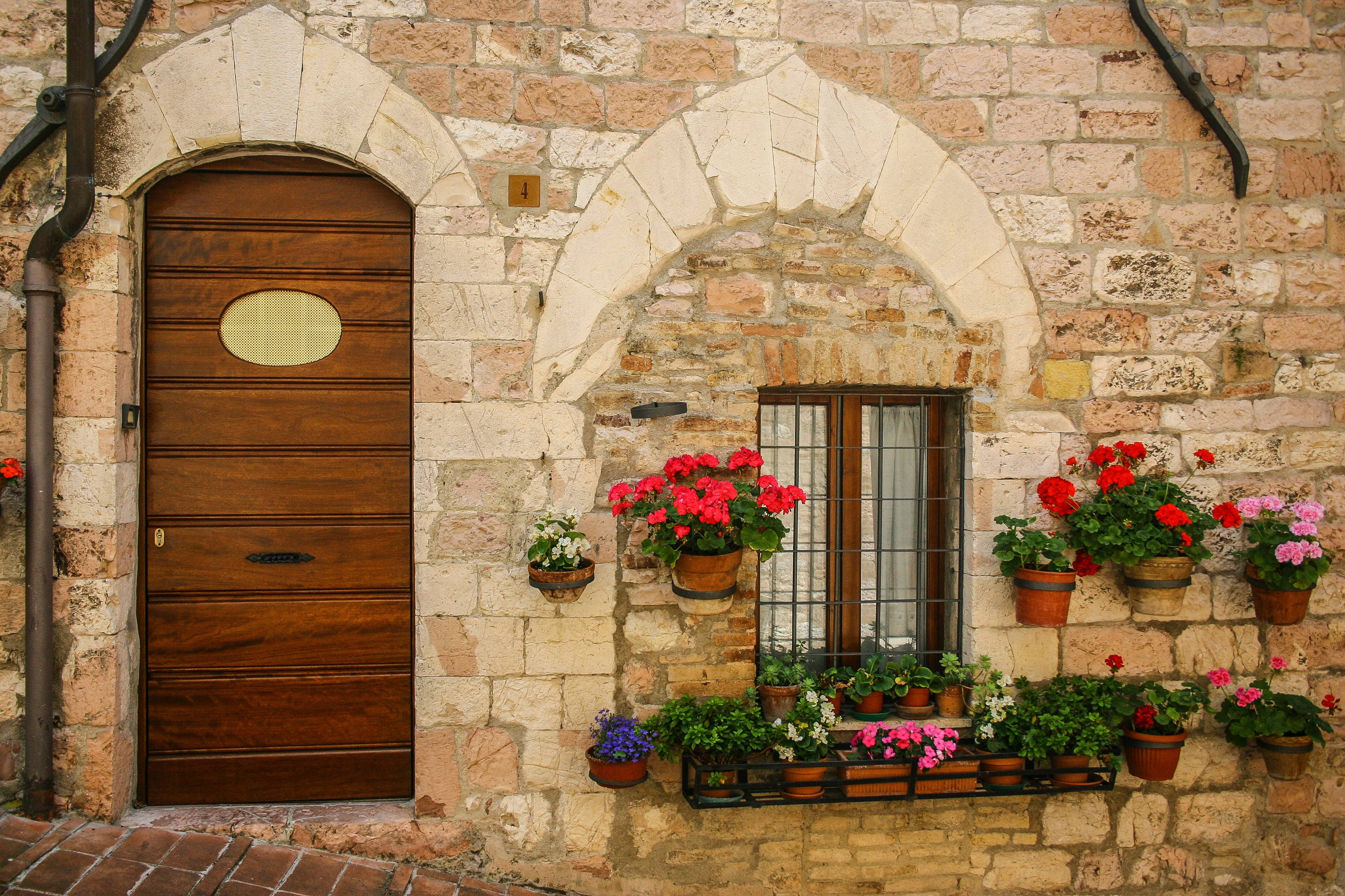 Pastel Vintage, rustic stone building facade, wooden door, 2K Desktop Wallpaper