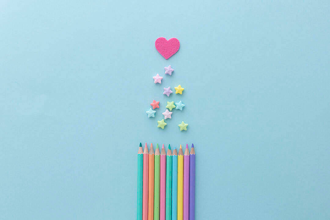 colorful pencils, light blue background, pastel star-shaped candies, SD Desktop Wallpaper
