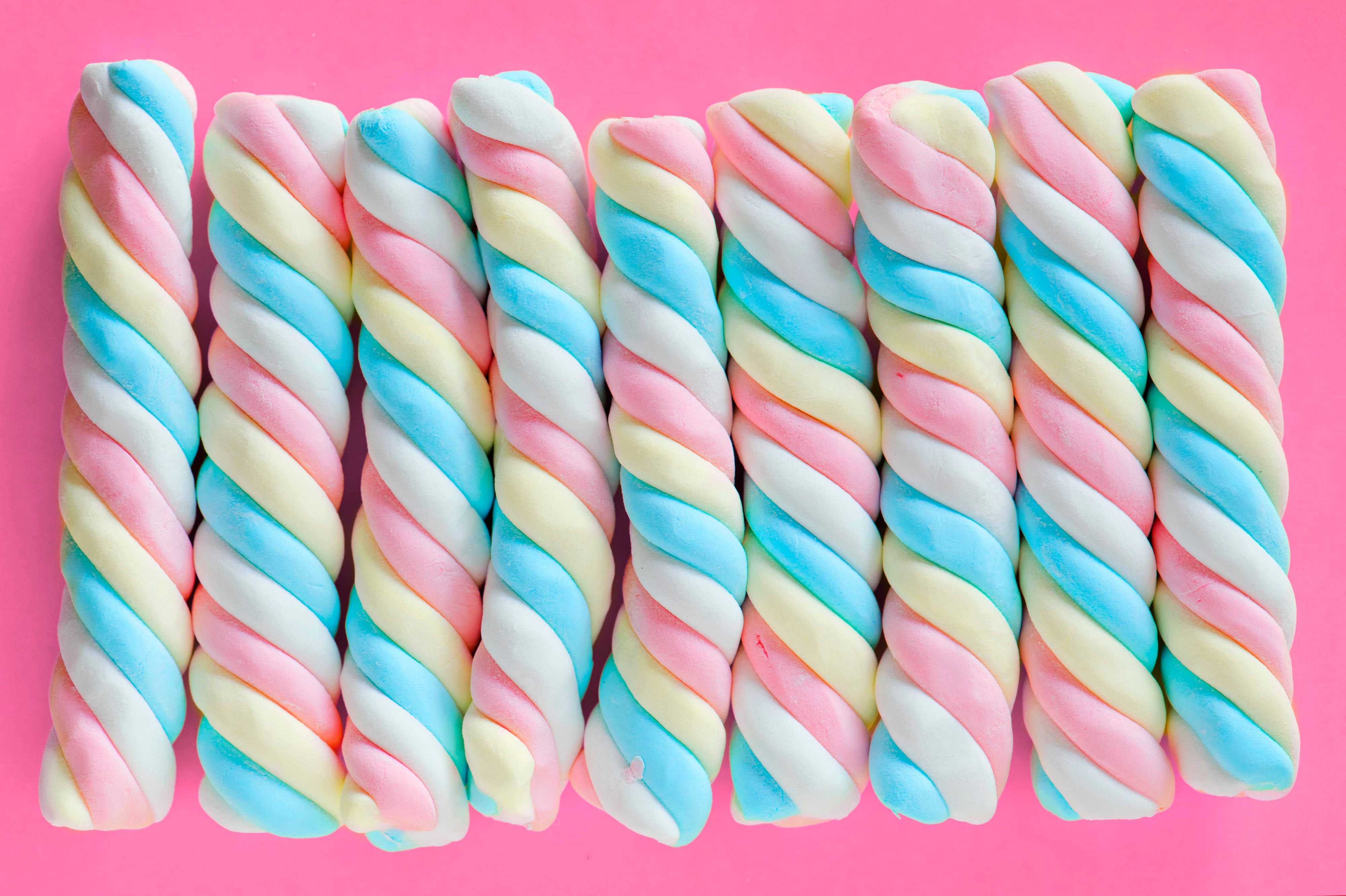 pastel rainbow twisted marshmallows, vibrant pink background, Marshmallows Pastels Aesthetic Computer, 4K Desktop Wallpaper