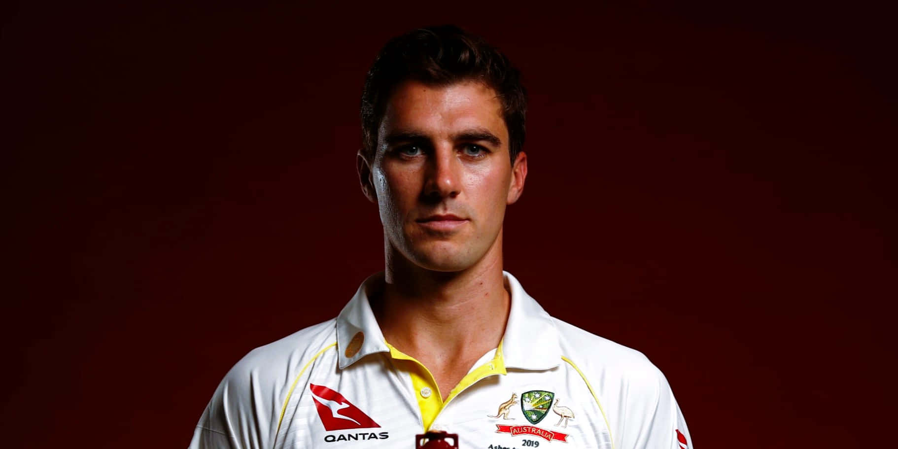 Pat Cummins, white and yellow uniform, deep red studio backdrop, HD Desktop Wallpaper