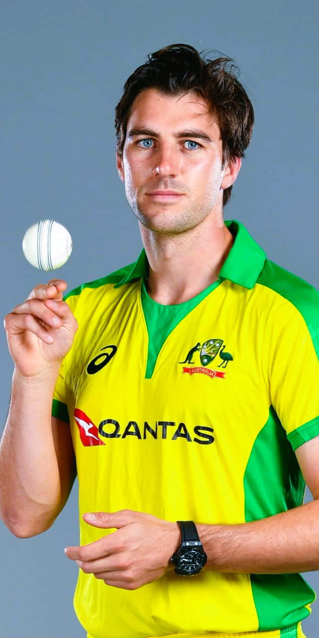 Pat Cummins, yellow and green jersey, white cricket ball, HD Phone Wallpaper