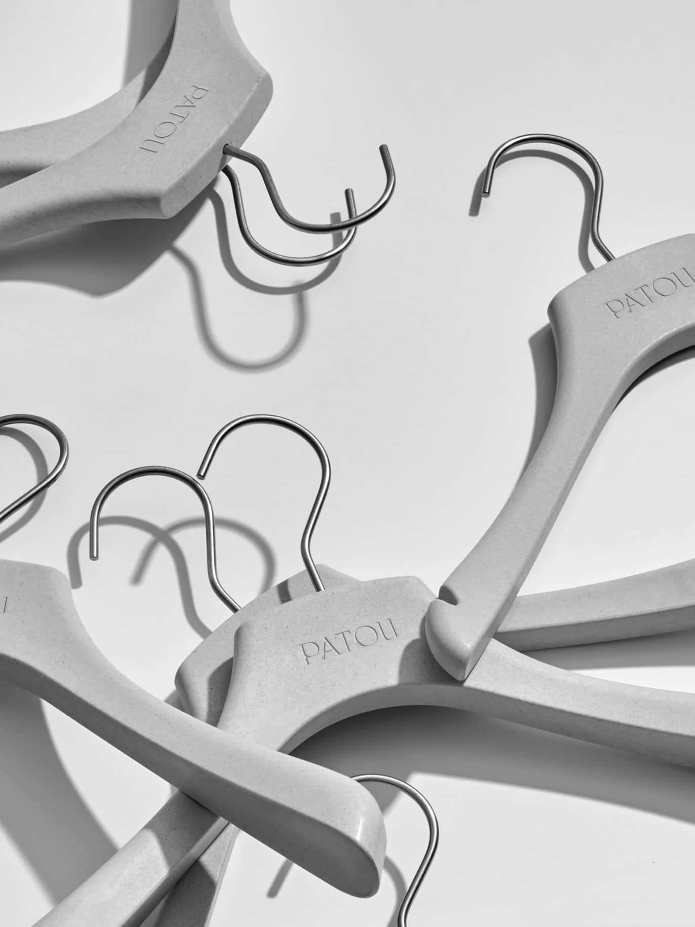 PATOU, wooden hangers, monochrome, HD Phone Wallpaper
