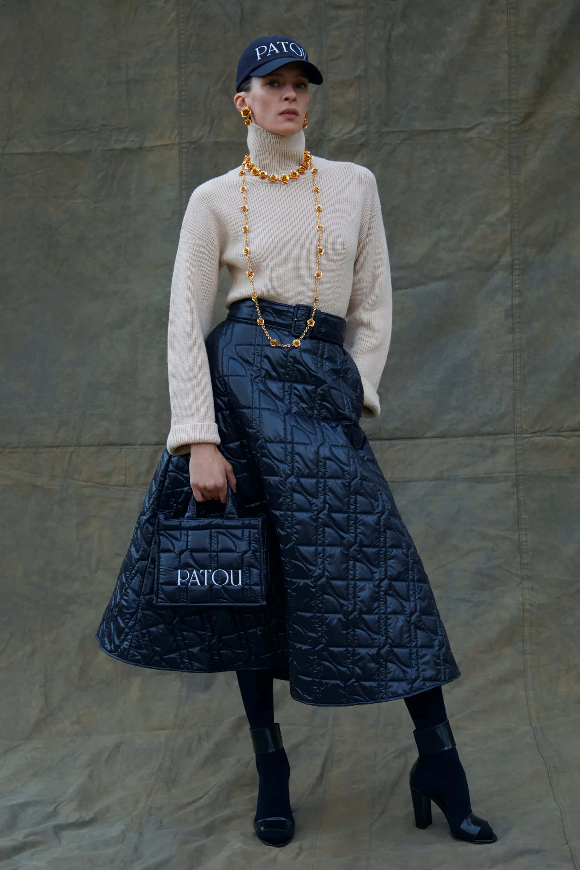 Patou, quilted navy skirt, cream turtleneck, 2K Phone Wallpaper