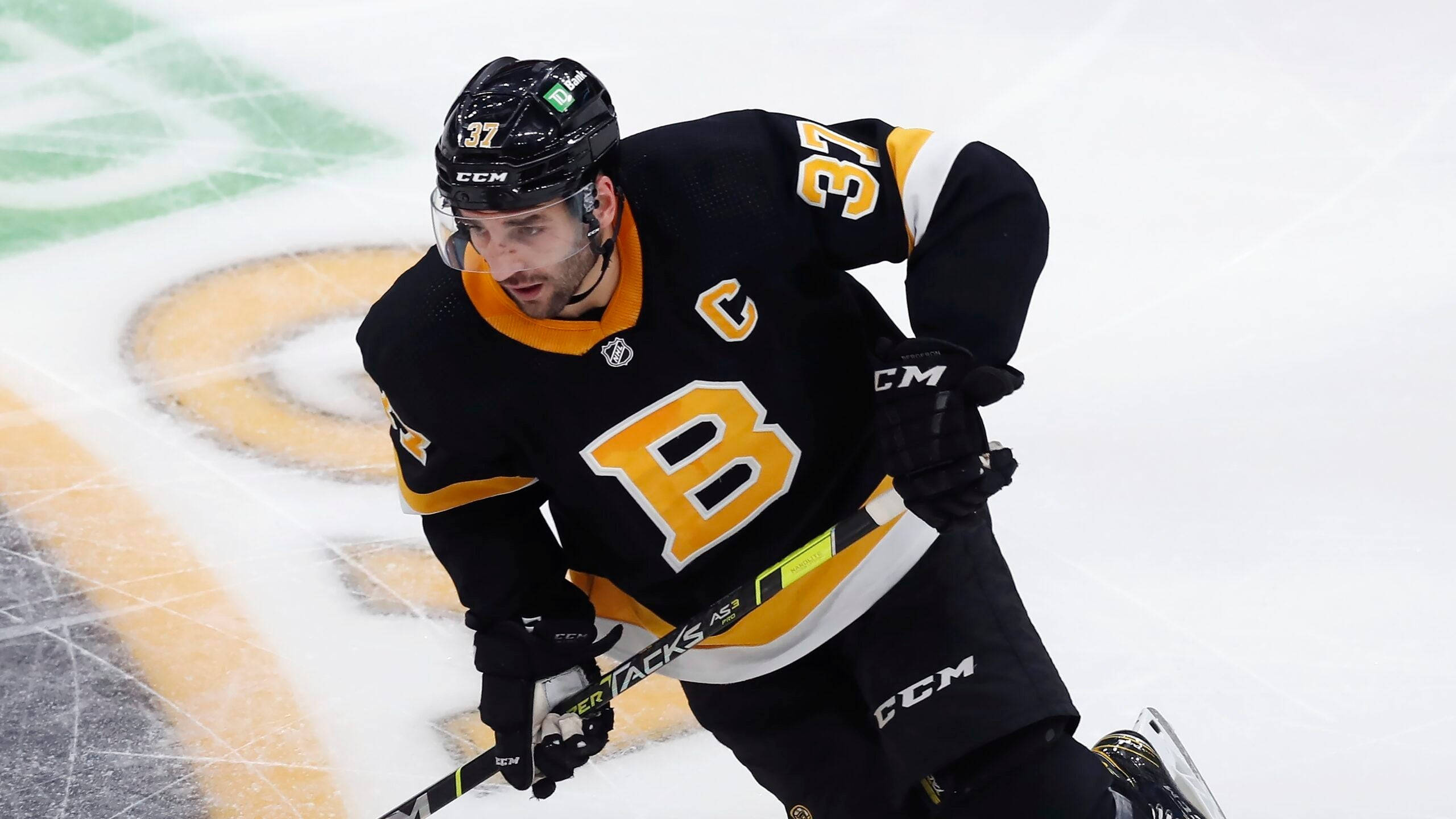Patrice Bergeron, black and gold jersey, ice rink, 2K Desktop Wallpaper