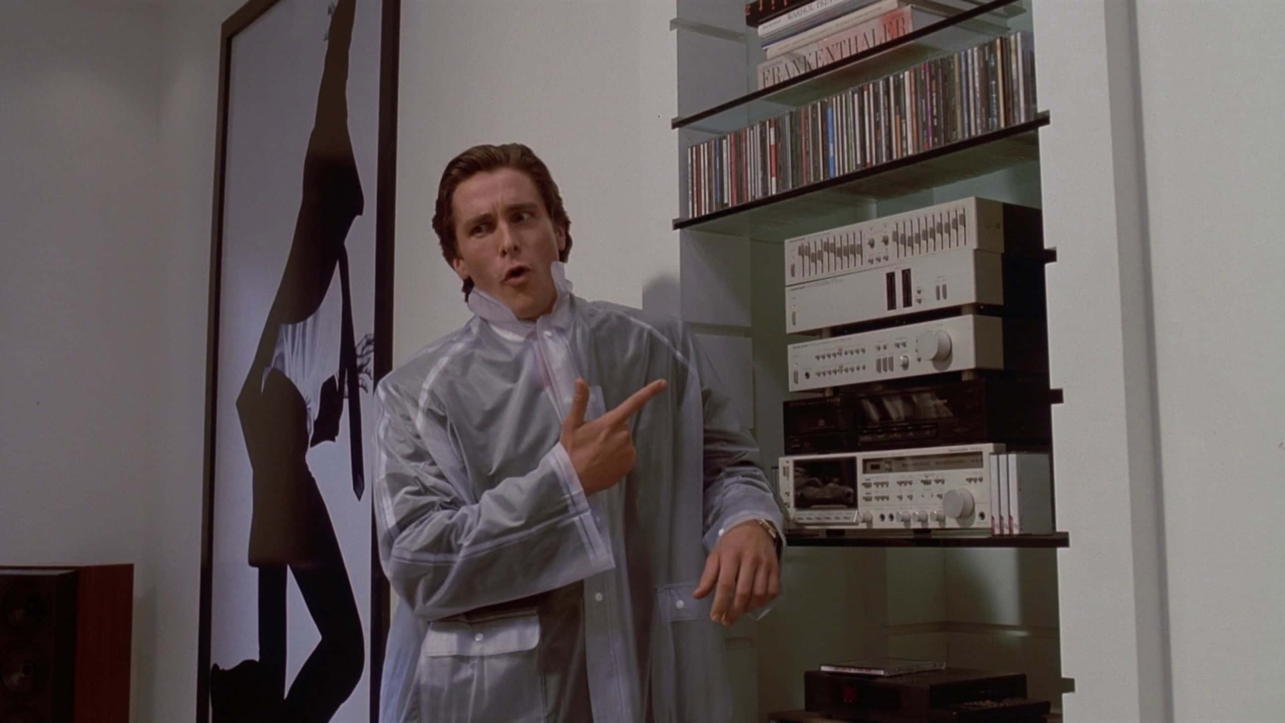 Patrick Bateman, transparent raincoat, wall-mounted audio system, 2K Desktop Wallpaper