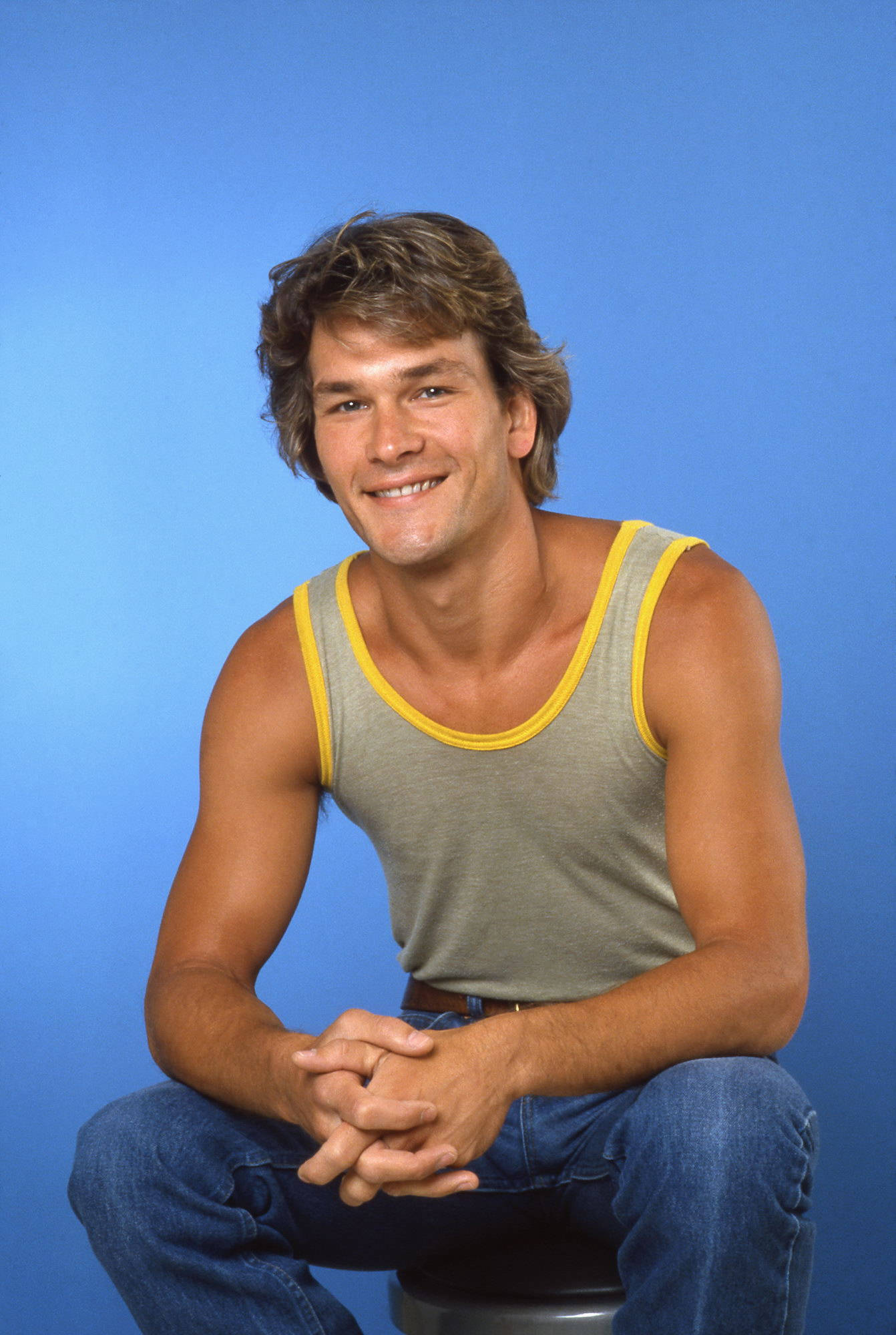 Patrick Swayze, tousled hair, gray tank top with yellow trim, Full HD Phone Wallpaper