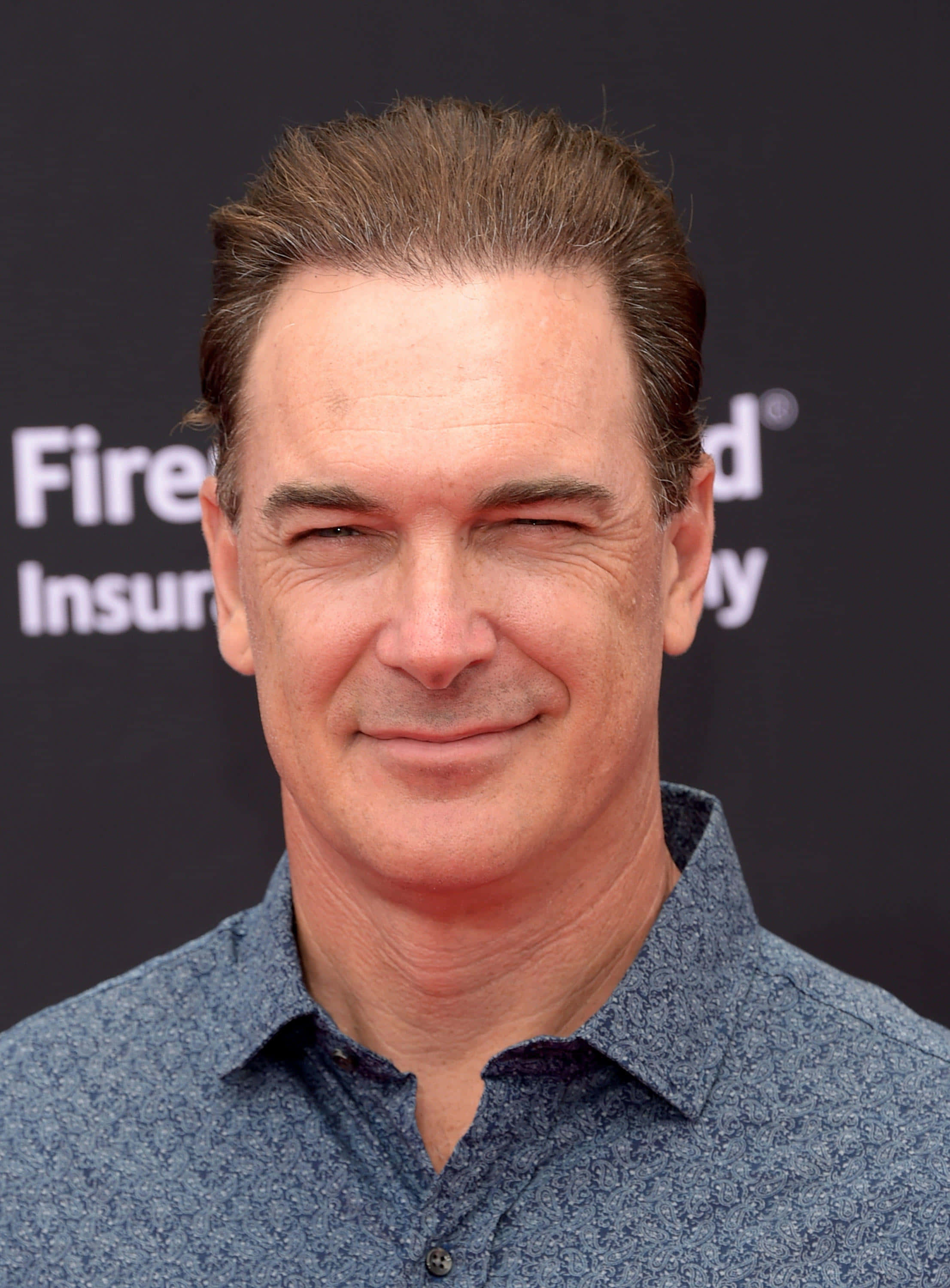 Patrick Warburton, blue patterned shirt, winking eyes, 2K Phone Wallpaper