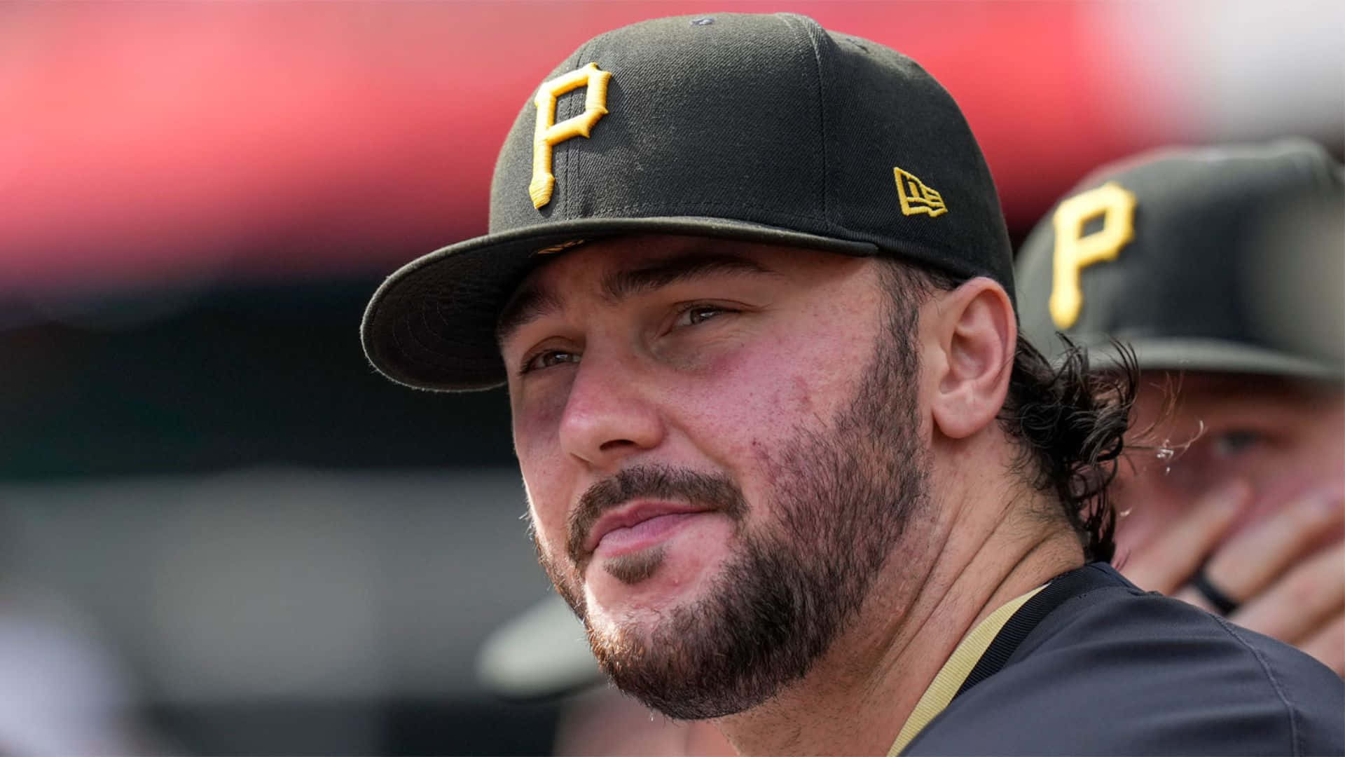 Paul Skenes, black cap, yellow 'P' logo, Full HD Desktop Wallpaper