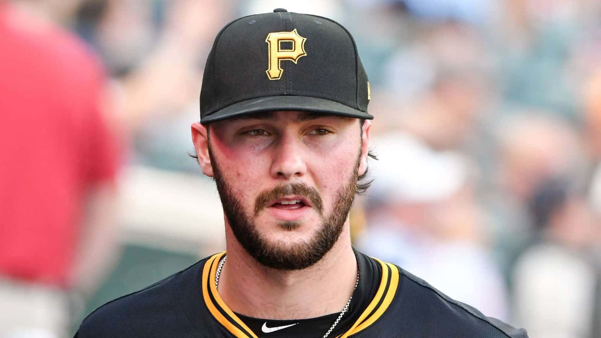 Paul Skenes, black cap, gold 'P' logo, Full HD Desktop Wallpaper